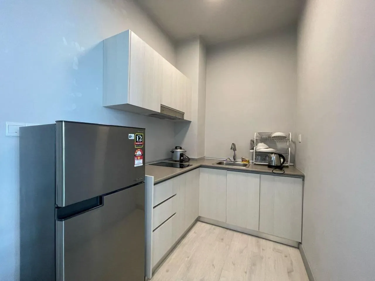 Kitchen or kitchenette in Jesselton Quay by Pinstay