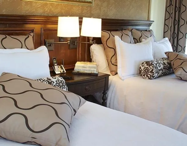 Bed in Guest House at Norwalk Inn