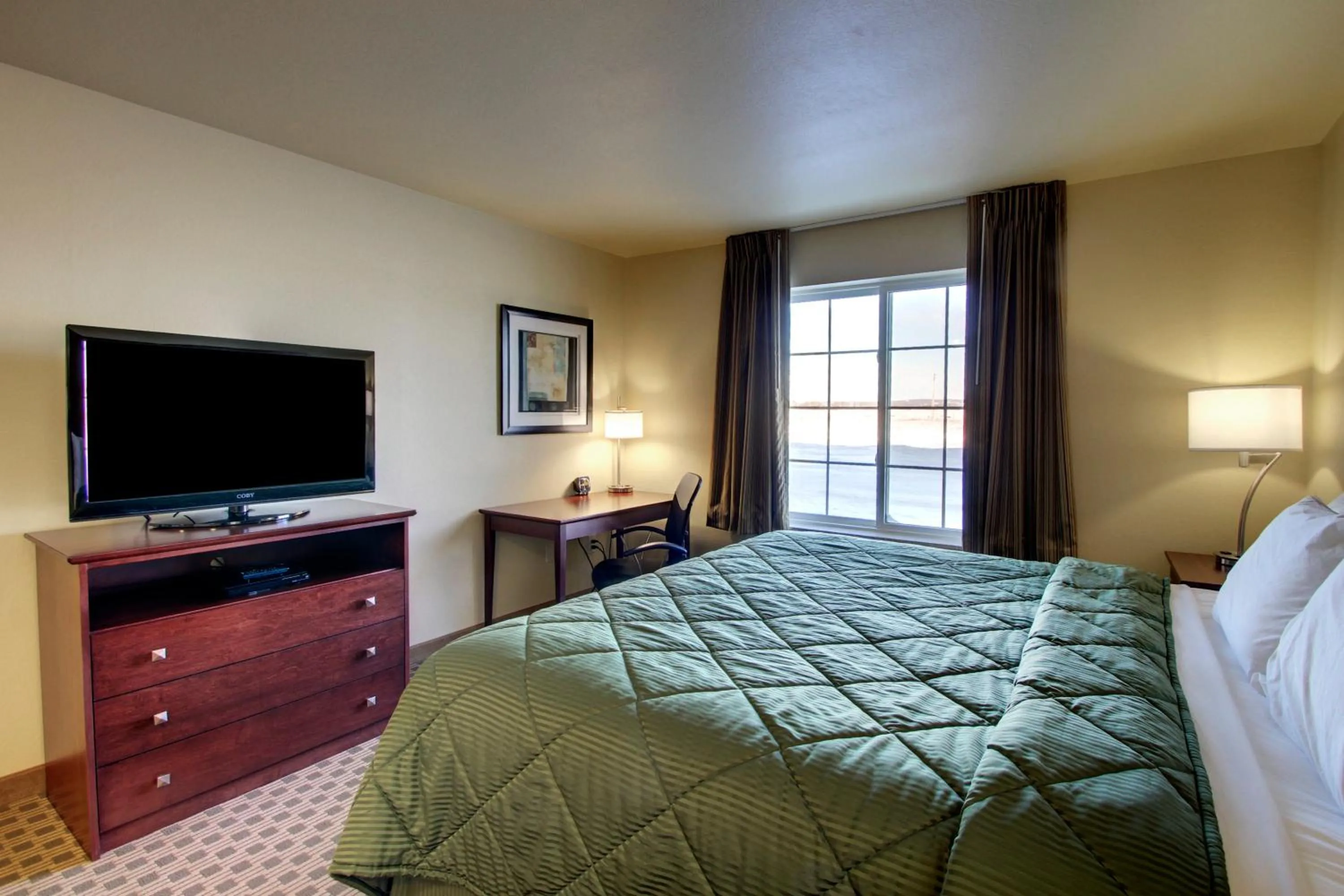 Bed in Cobblestone Inn & Suites - Harper