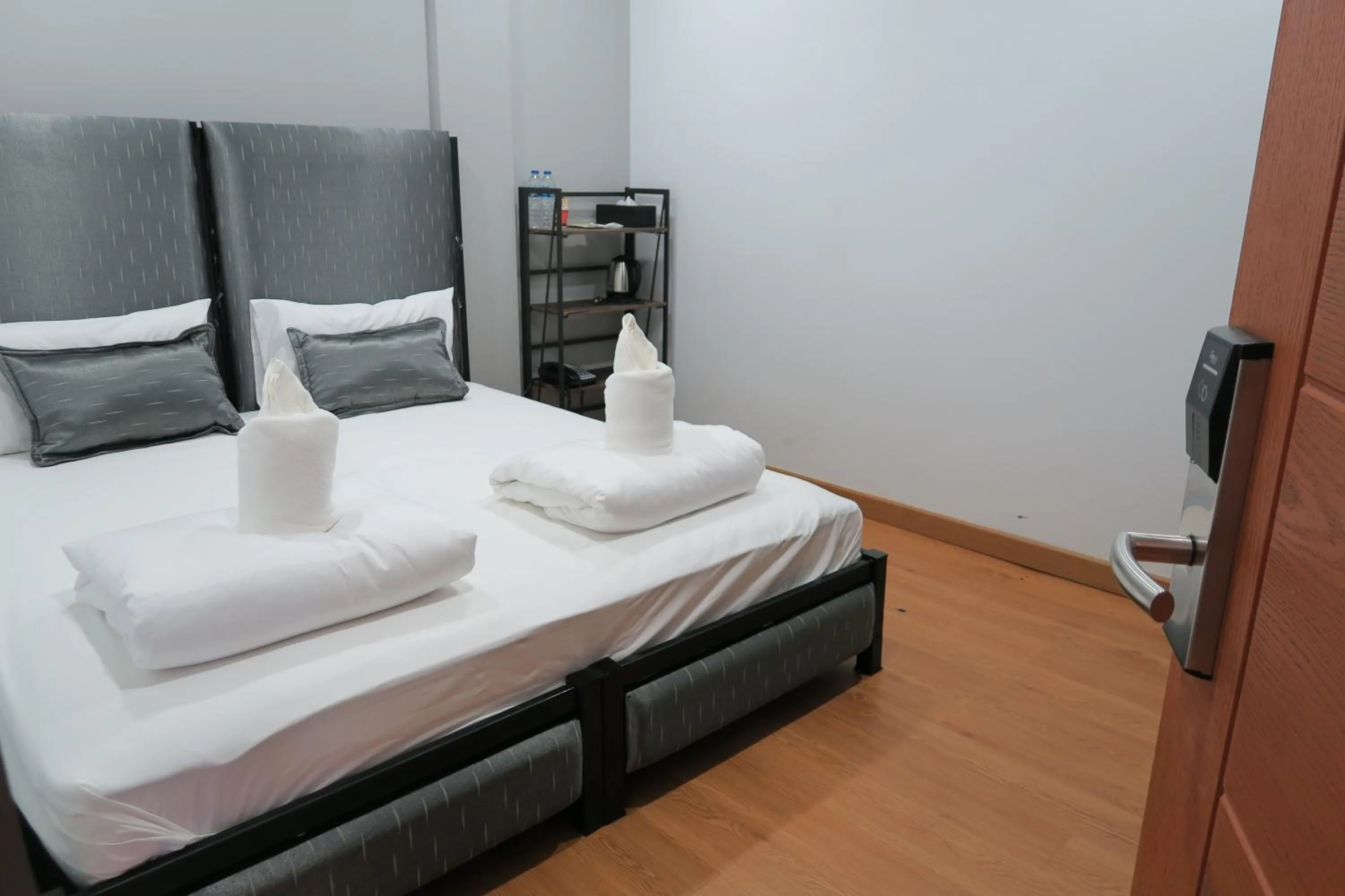 Bed in The Mira Hotel Chiang Rai