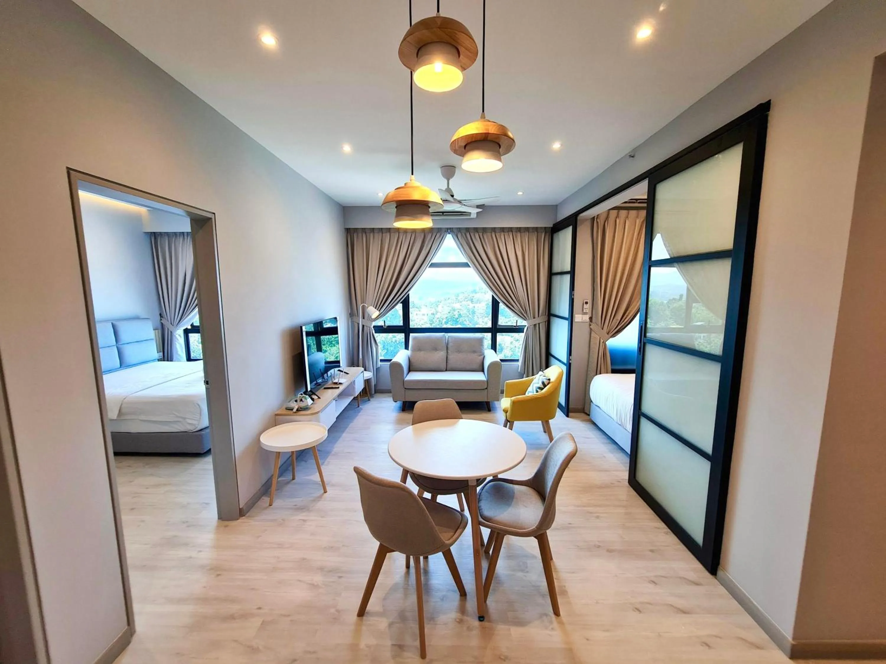 Living room, Bed in Sunset Seaview Vacation Condos @ Jesselton Quay