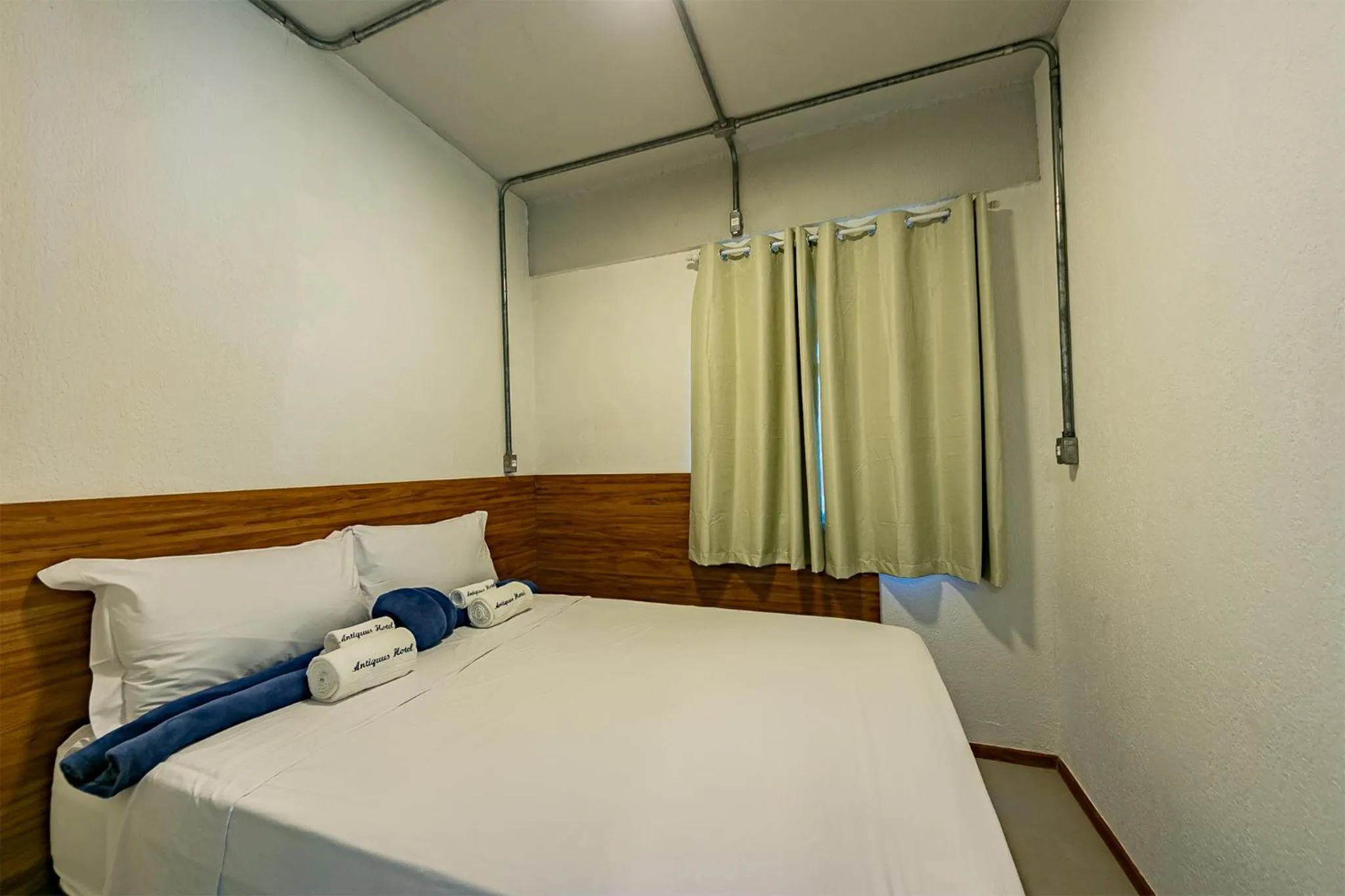 Bed in Antiquus ApartHotel