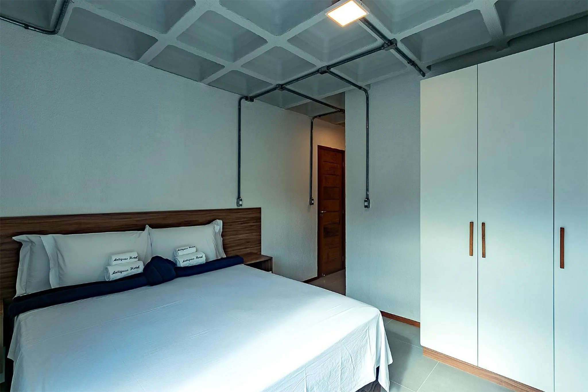 Bed in Antiquus ApartHotel