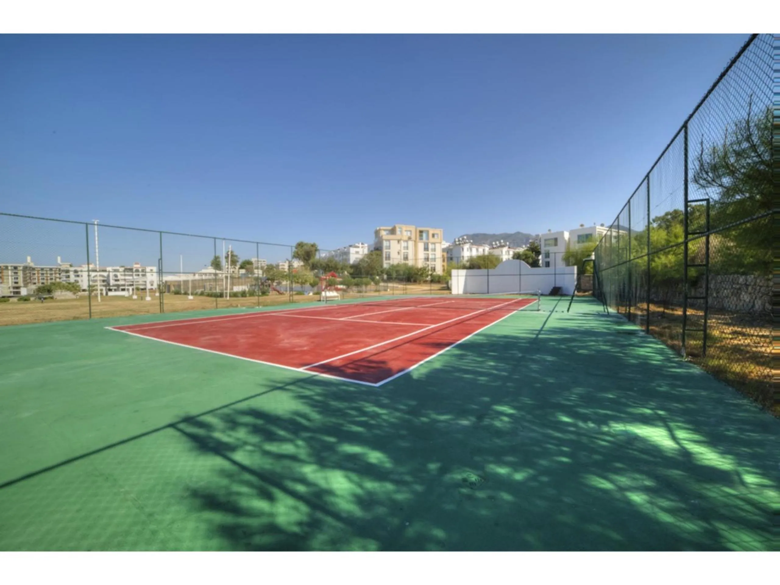Tennis court in Jasmine Court Hotel & Casino