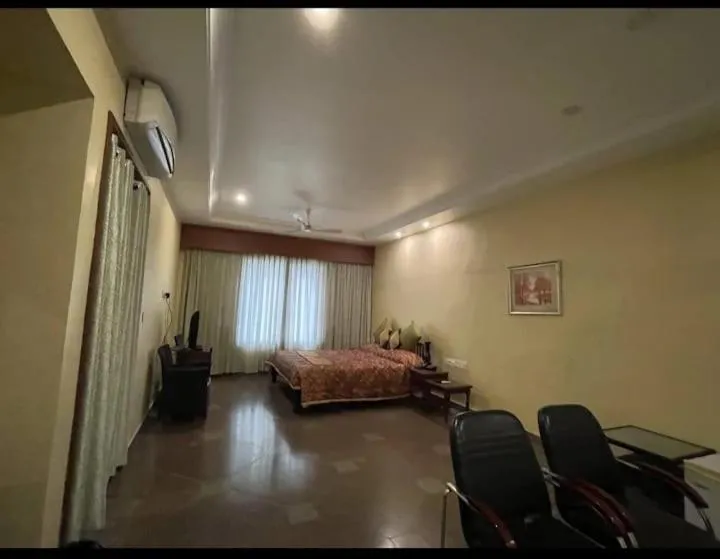 Bed in KRISHNA HERITAGE RESORT