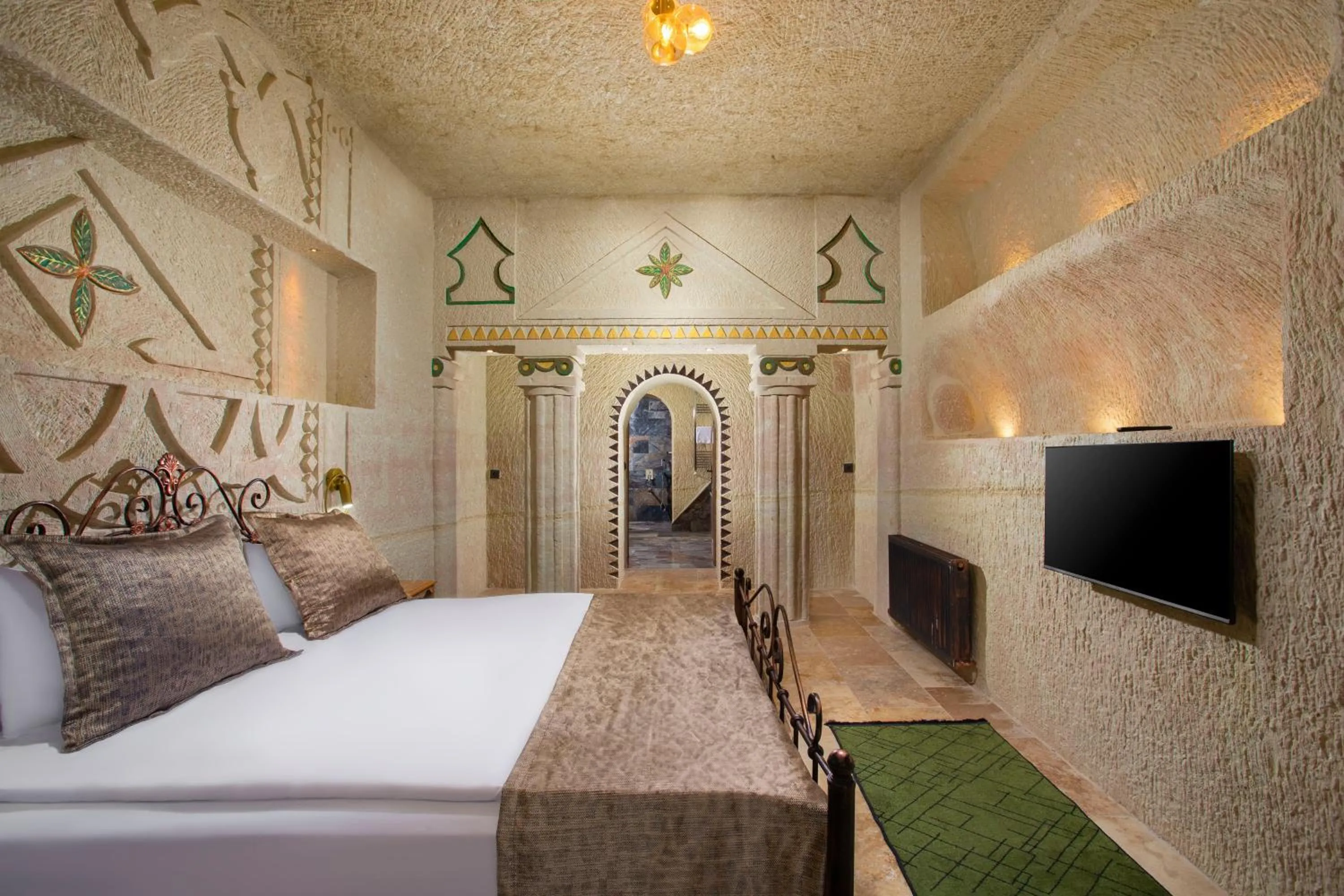 Bed in Dionysos Cave Cappadocia Hotel