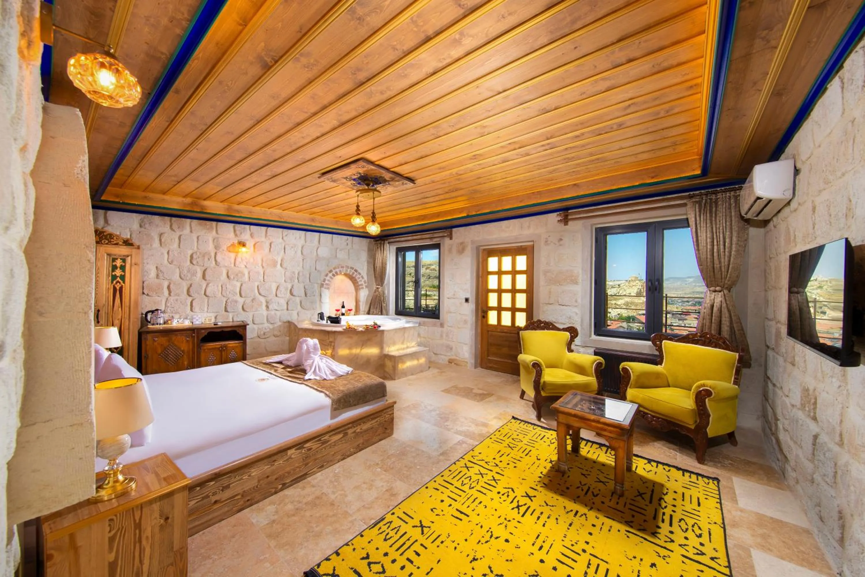 Photo of the whole room, Bed in Dionysos Cave Cappadocia Hotel