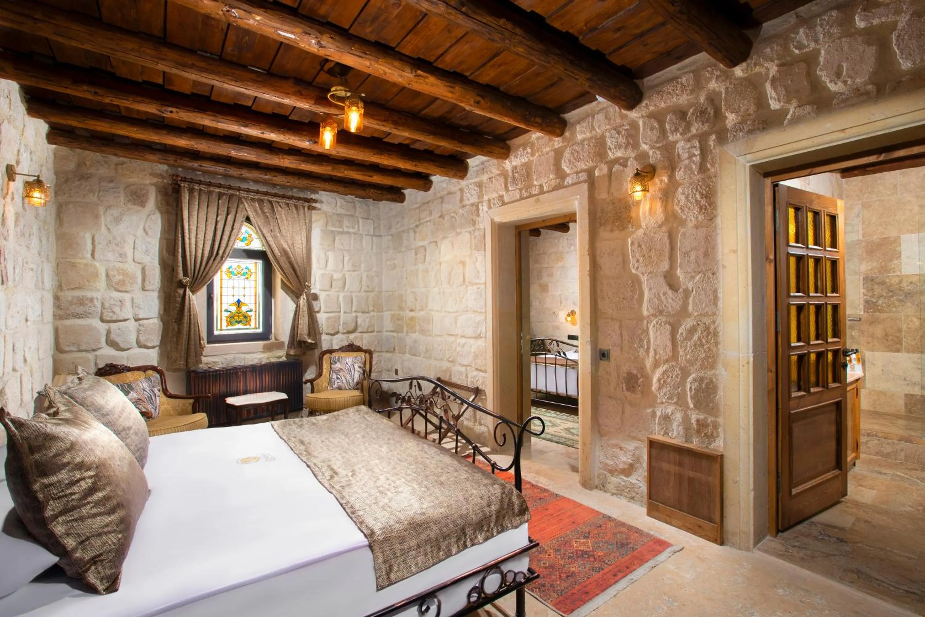 Photo of the whole room, Bed in Dionysos Cave Cappadocia Hotel