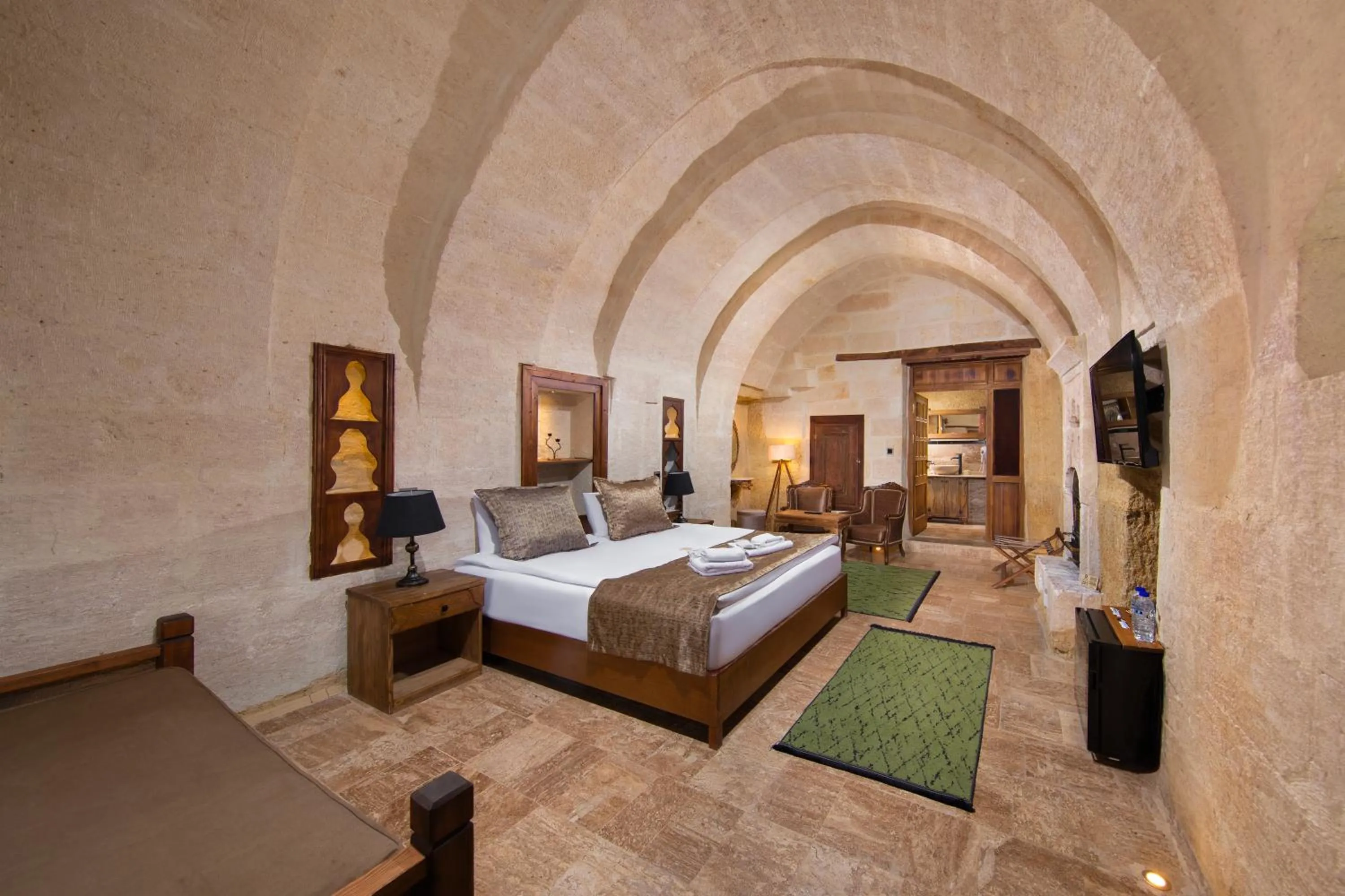 Photo of the whole room, Bed in Dionysos Cave Cappadocia Hotel