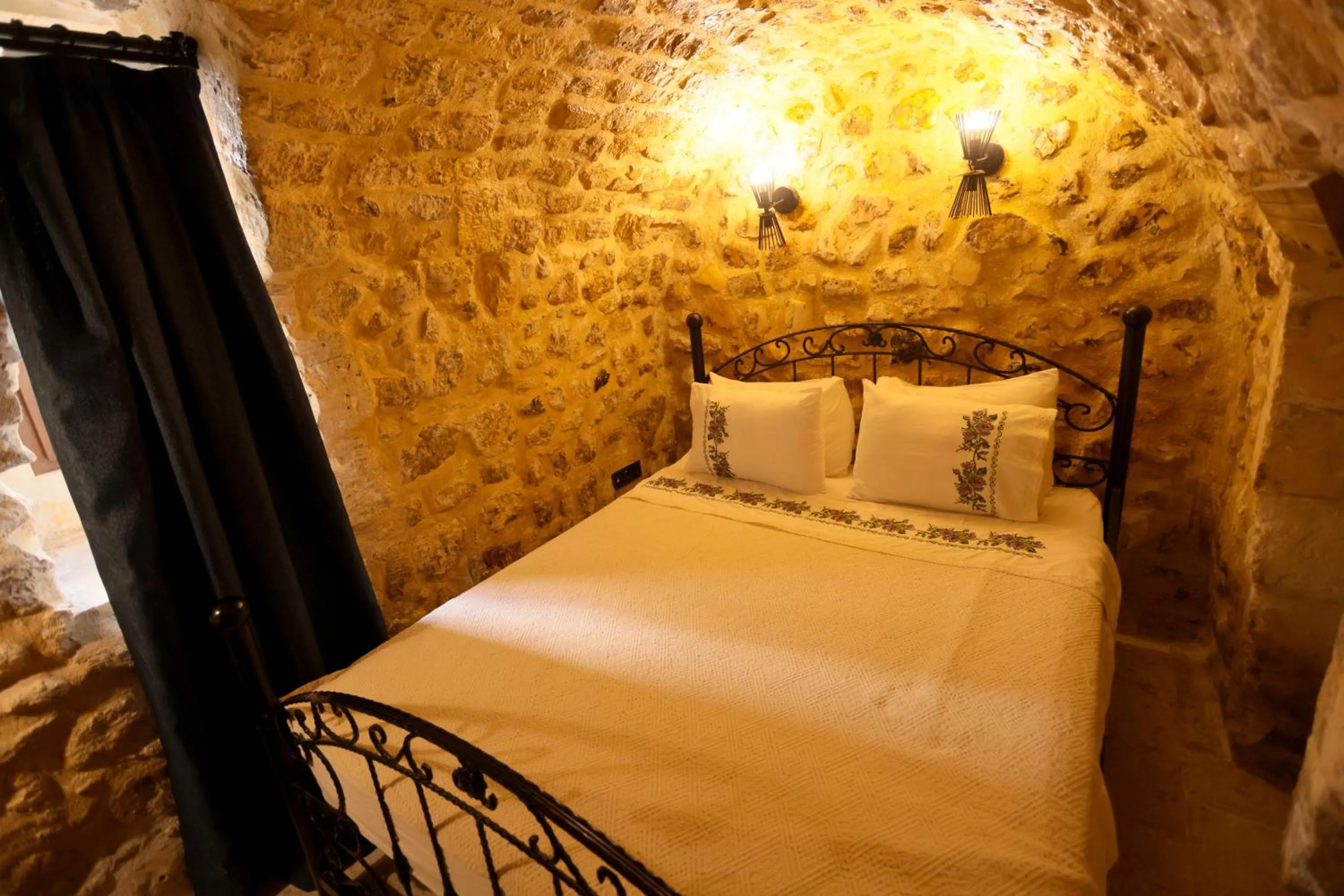 Bed in ASTARTE HOTEL