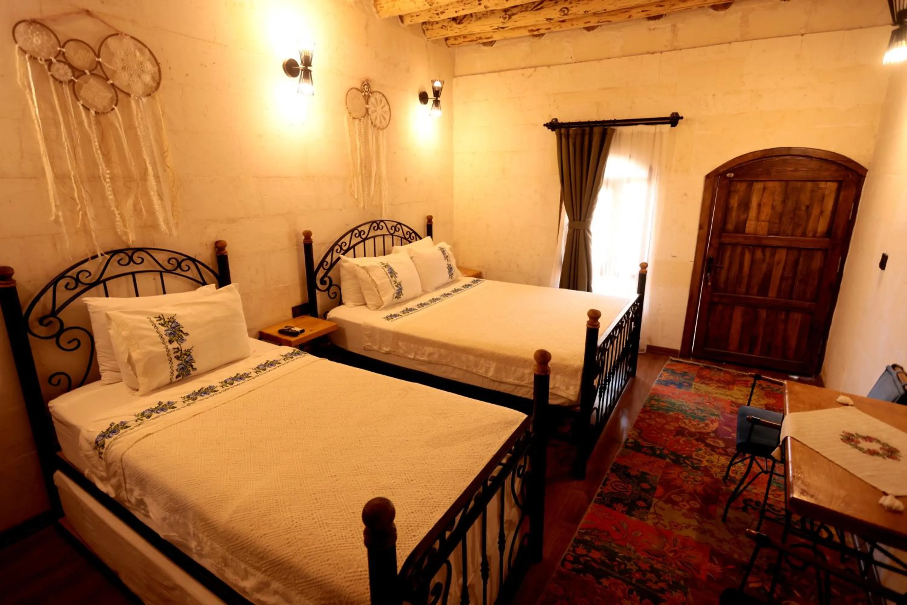 Bed in ASTARTE HOTEL