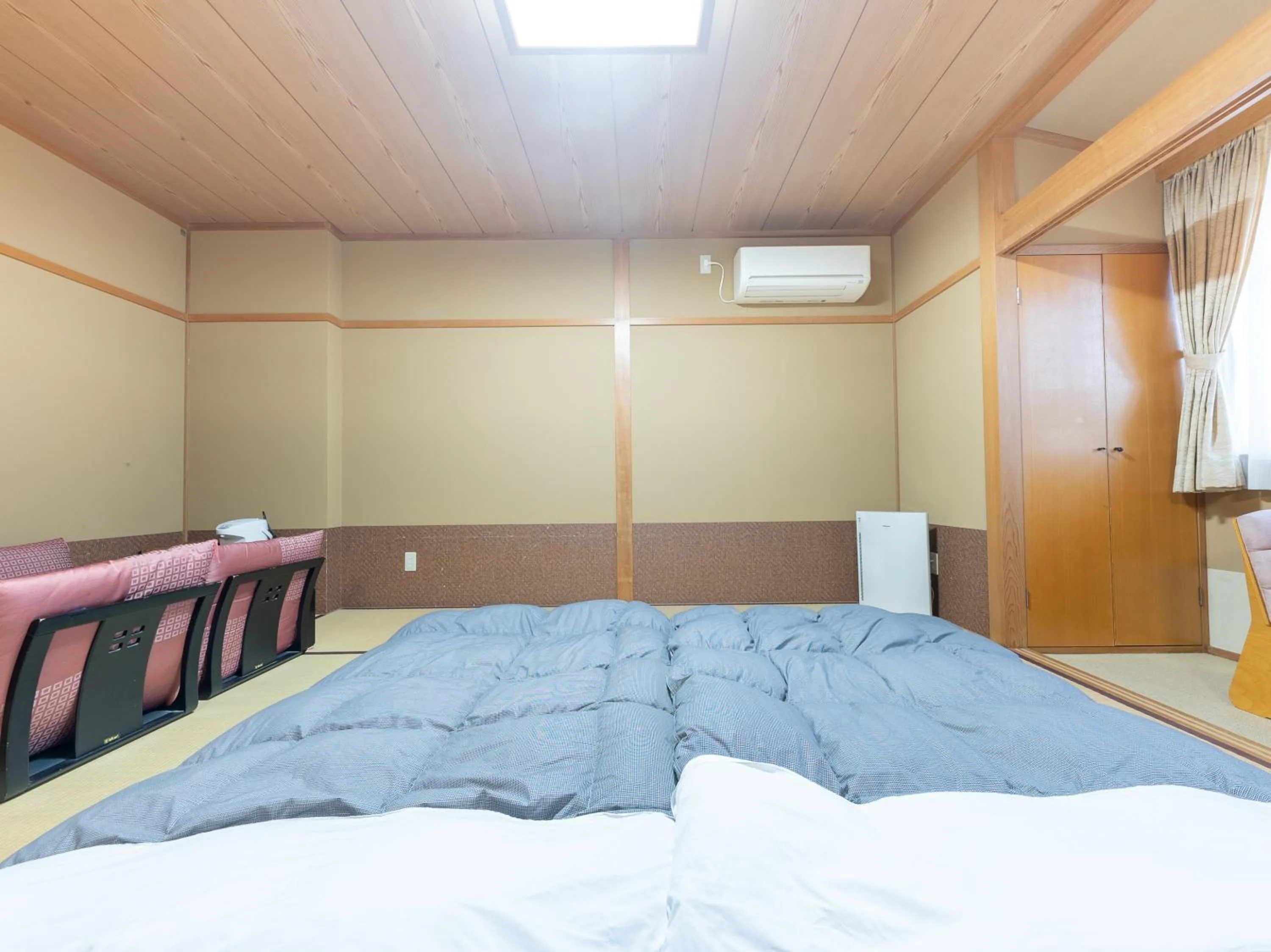 Bed in Tabist Hotel Iyashi no Sato