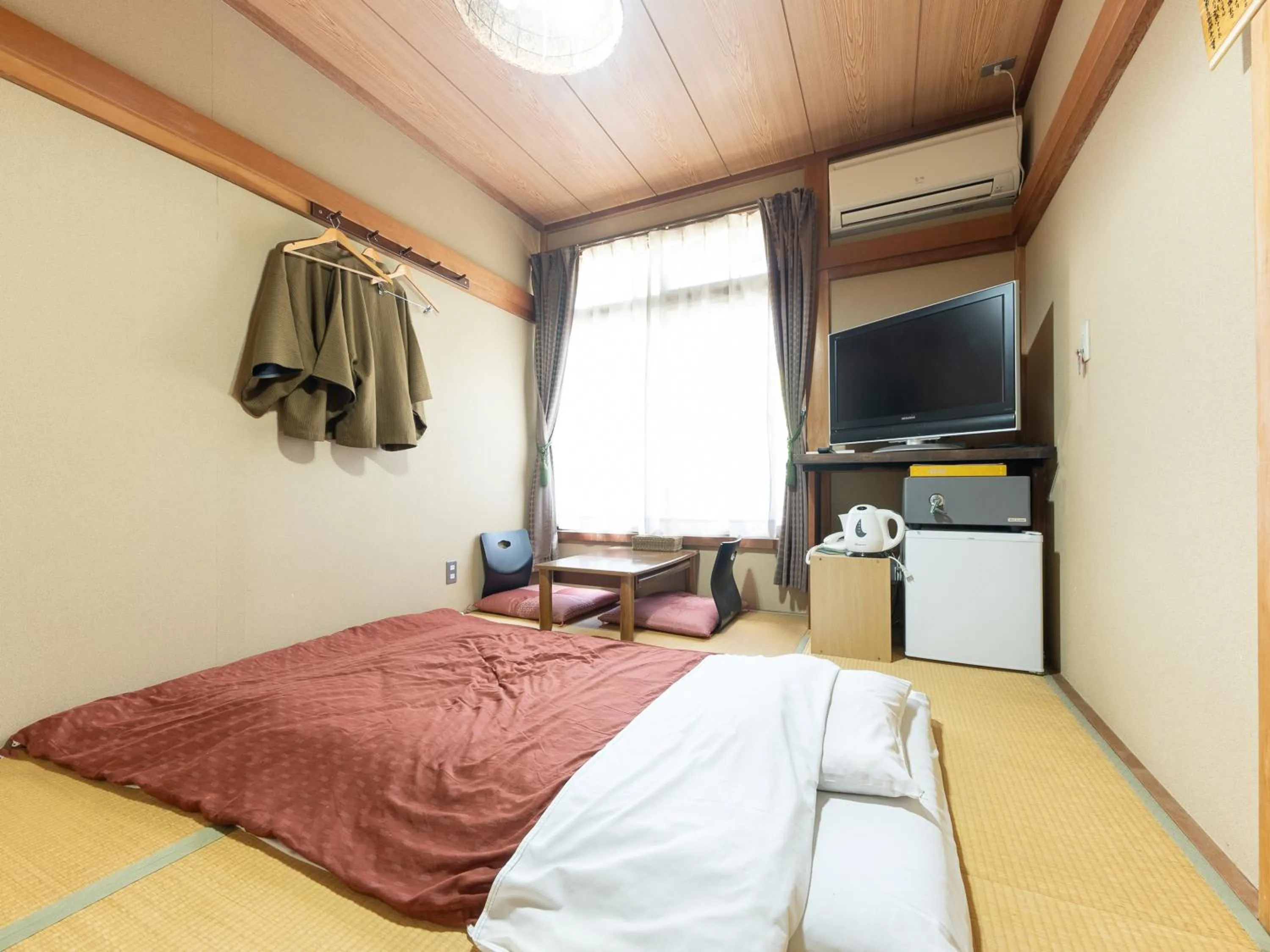 Bed in Tabist Hotel Iyashi no Sato