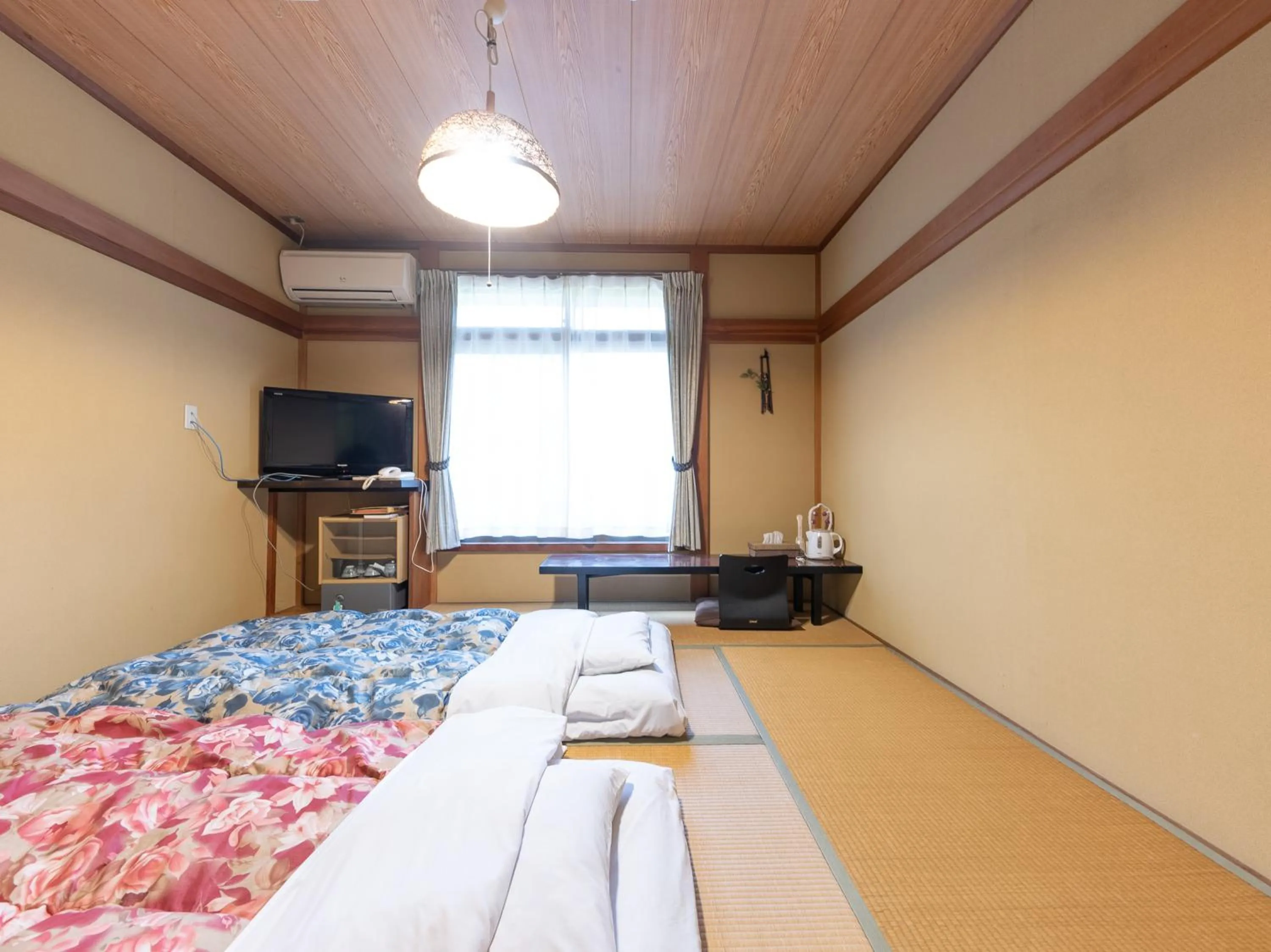 Bed in Tabist Hotel Iyashi no Sato