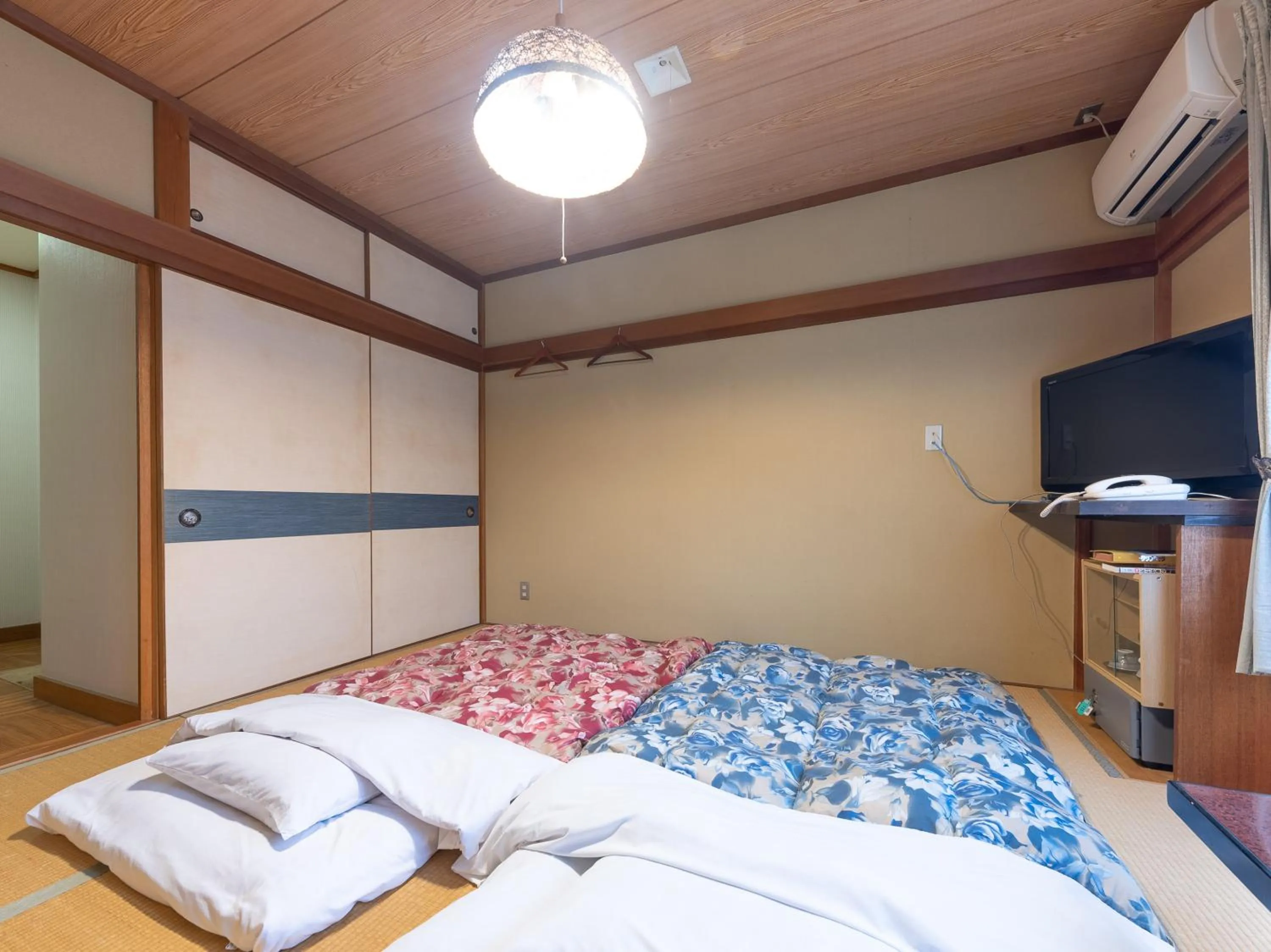 Bed in Tabist Hotel Iyashi no Sato