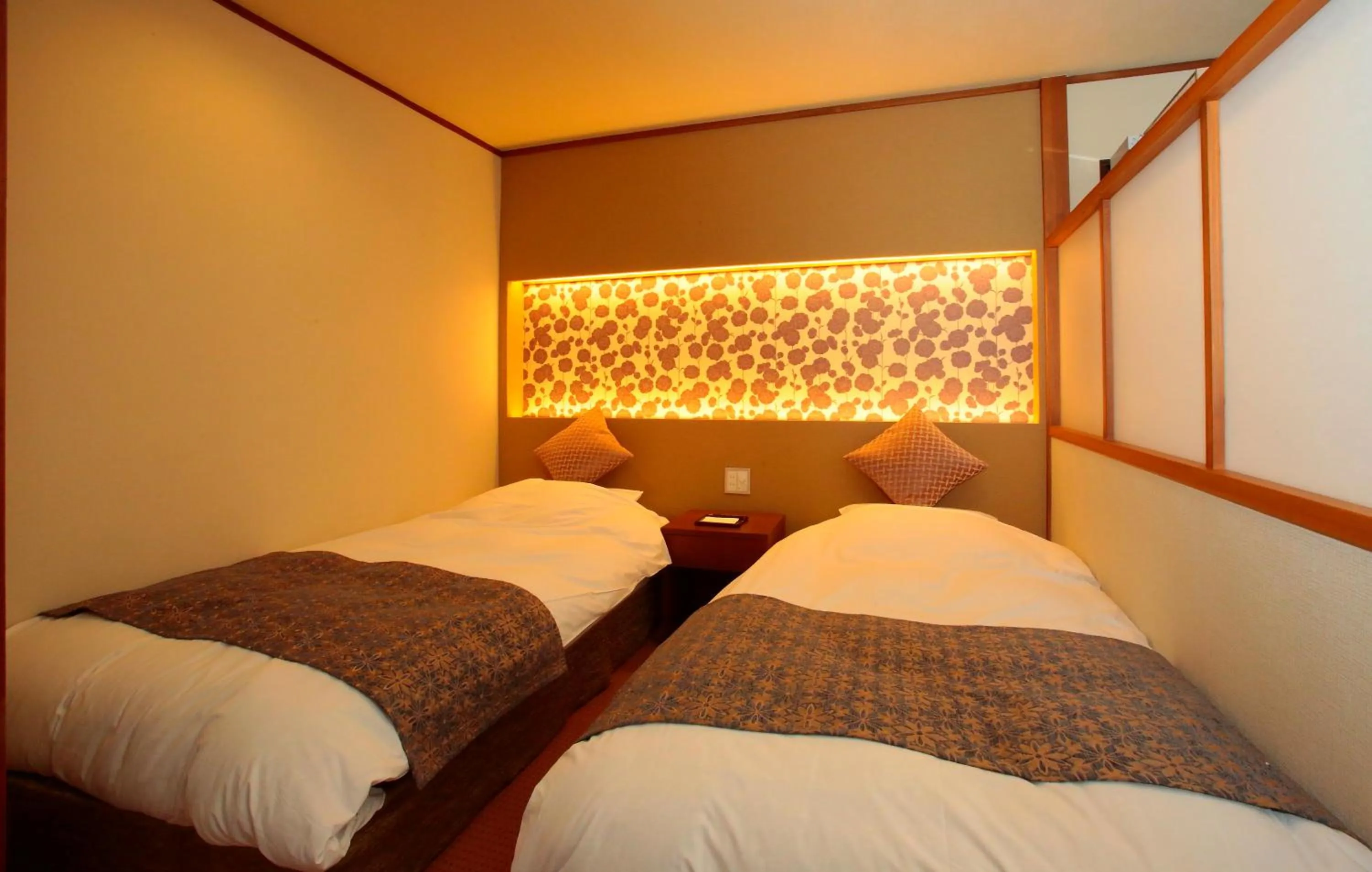 Property logo or sign, Bed in Itsuura Kanko Hotel