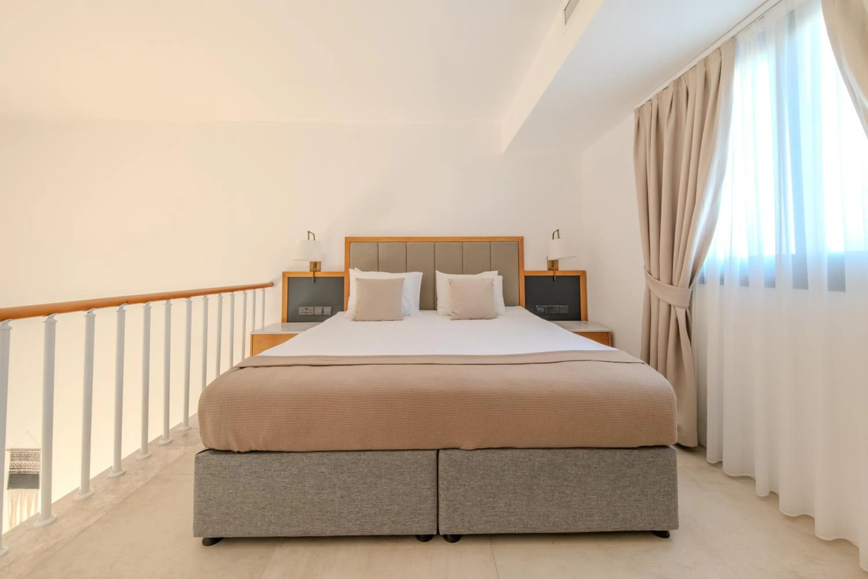 Bed in Palmonte Suites Hotel & SPA