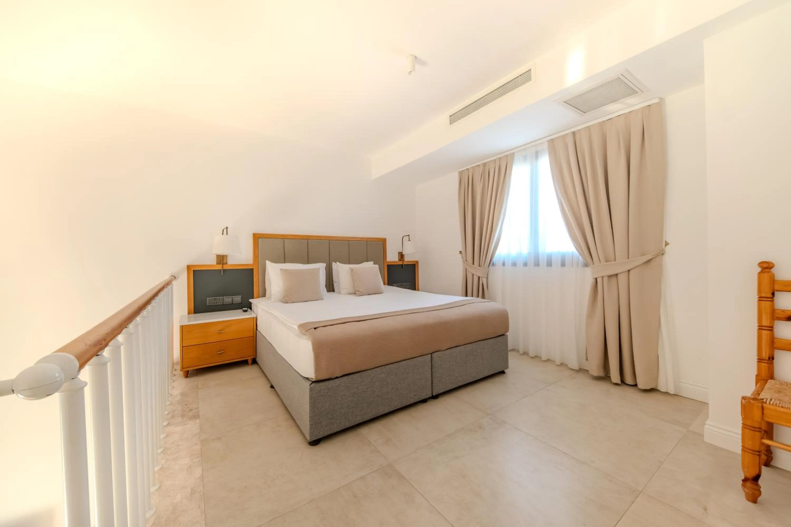 Bed in Palmonte Suites Hotel & SPA