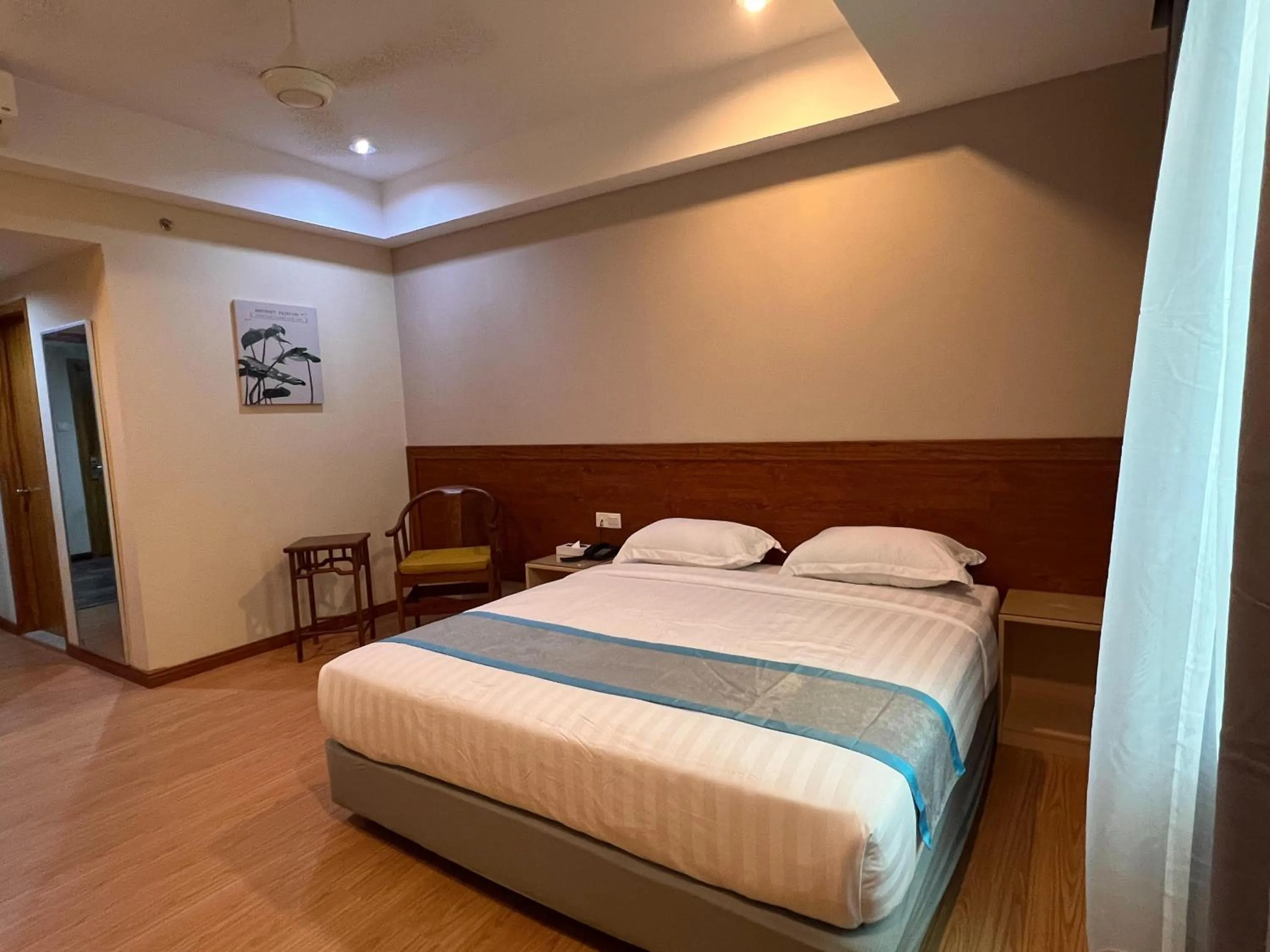 Bed in TD CAPITAL HOTEL