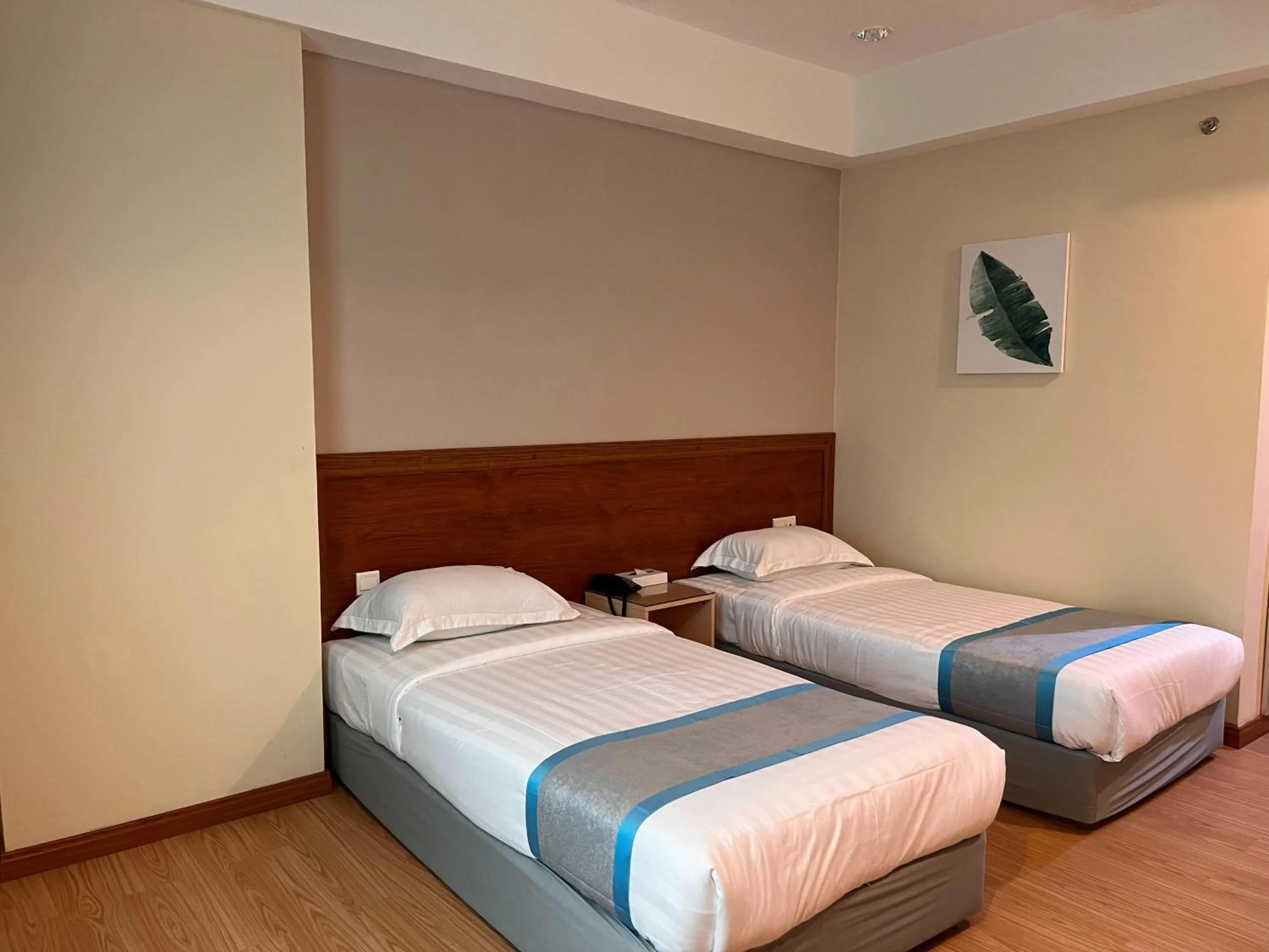 Bed in TD CAPITAL HOTEL