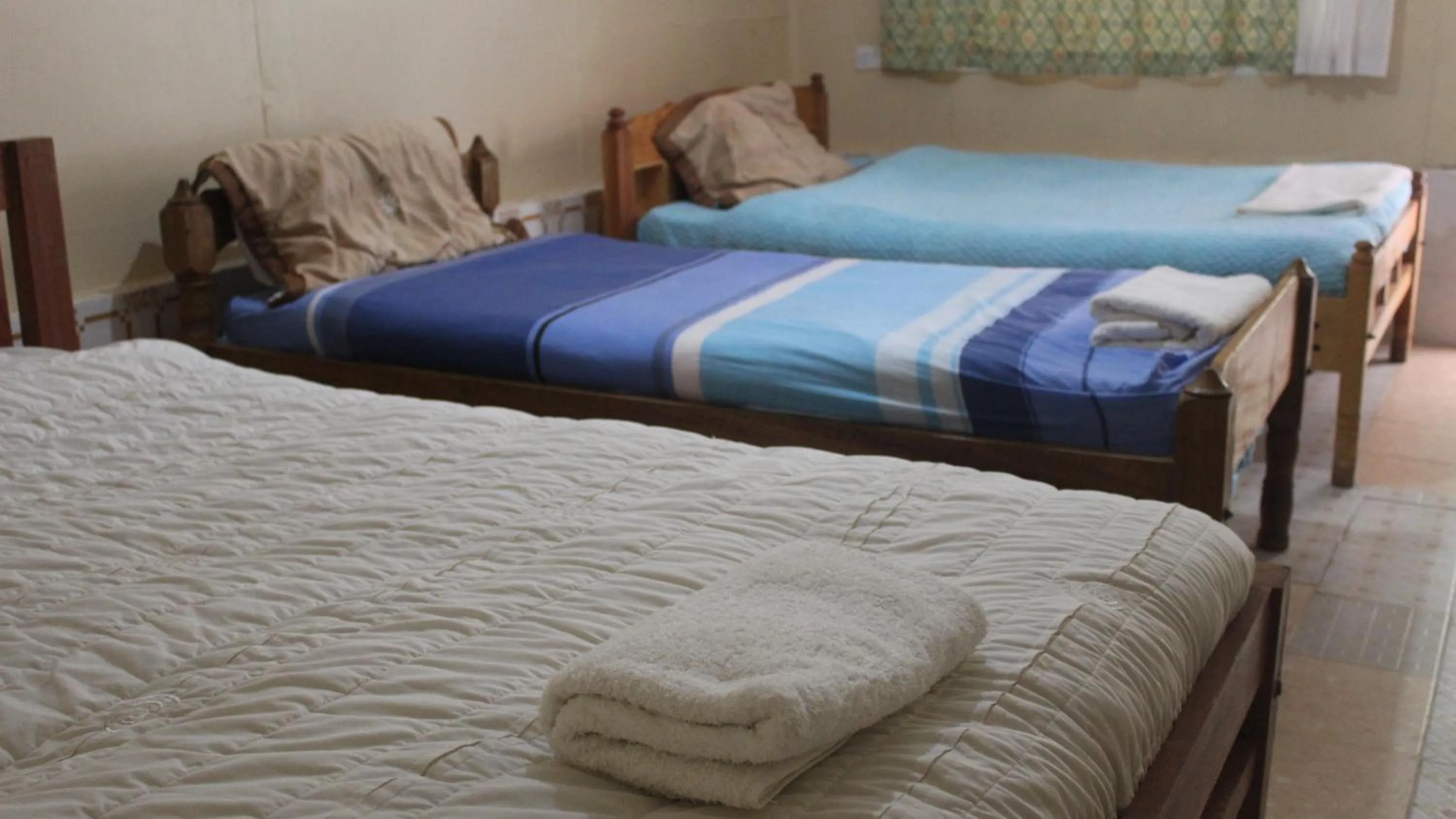 Bed in Tranquil Homestays