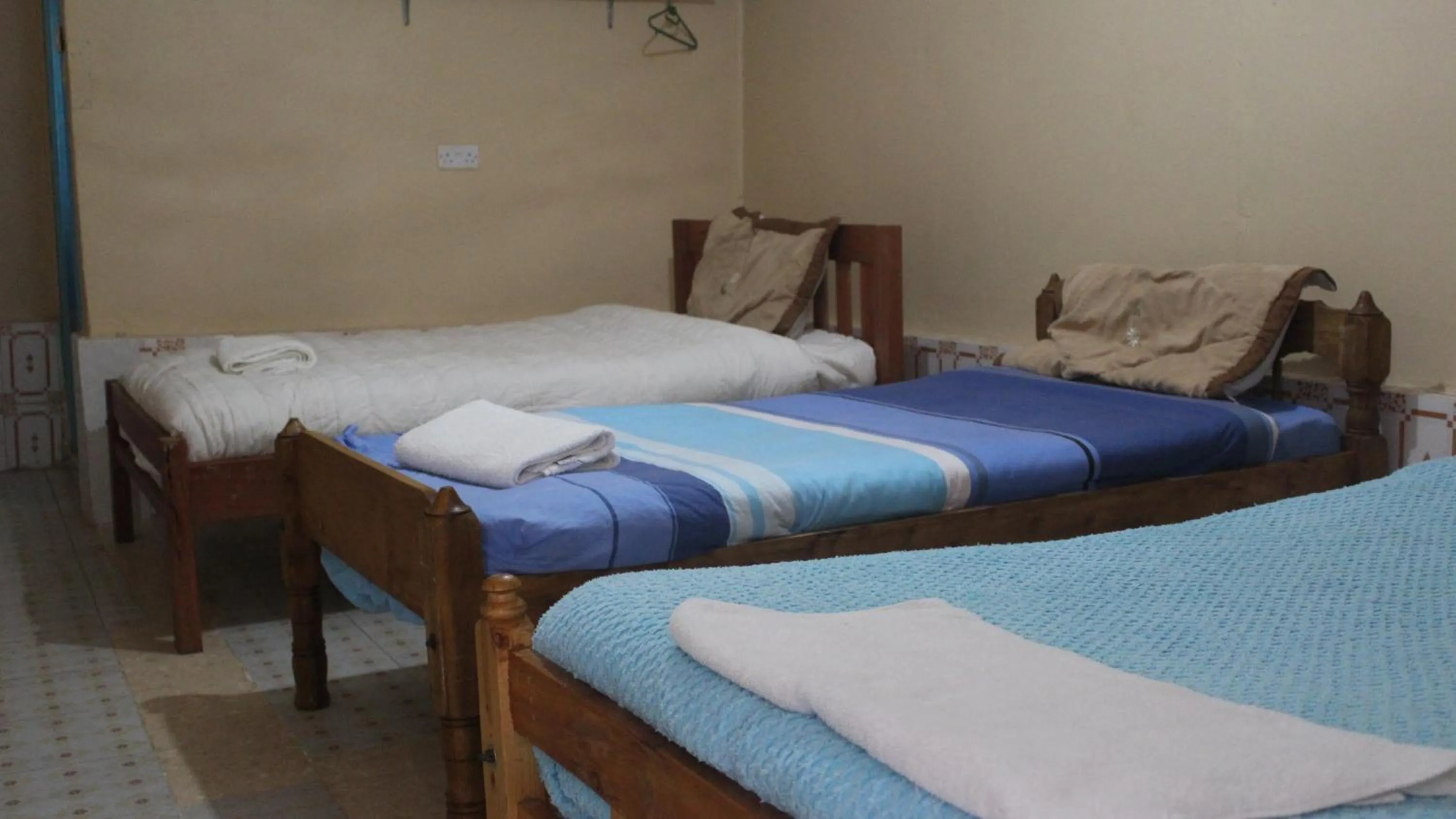 Bed in Tranquil Homestays