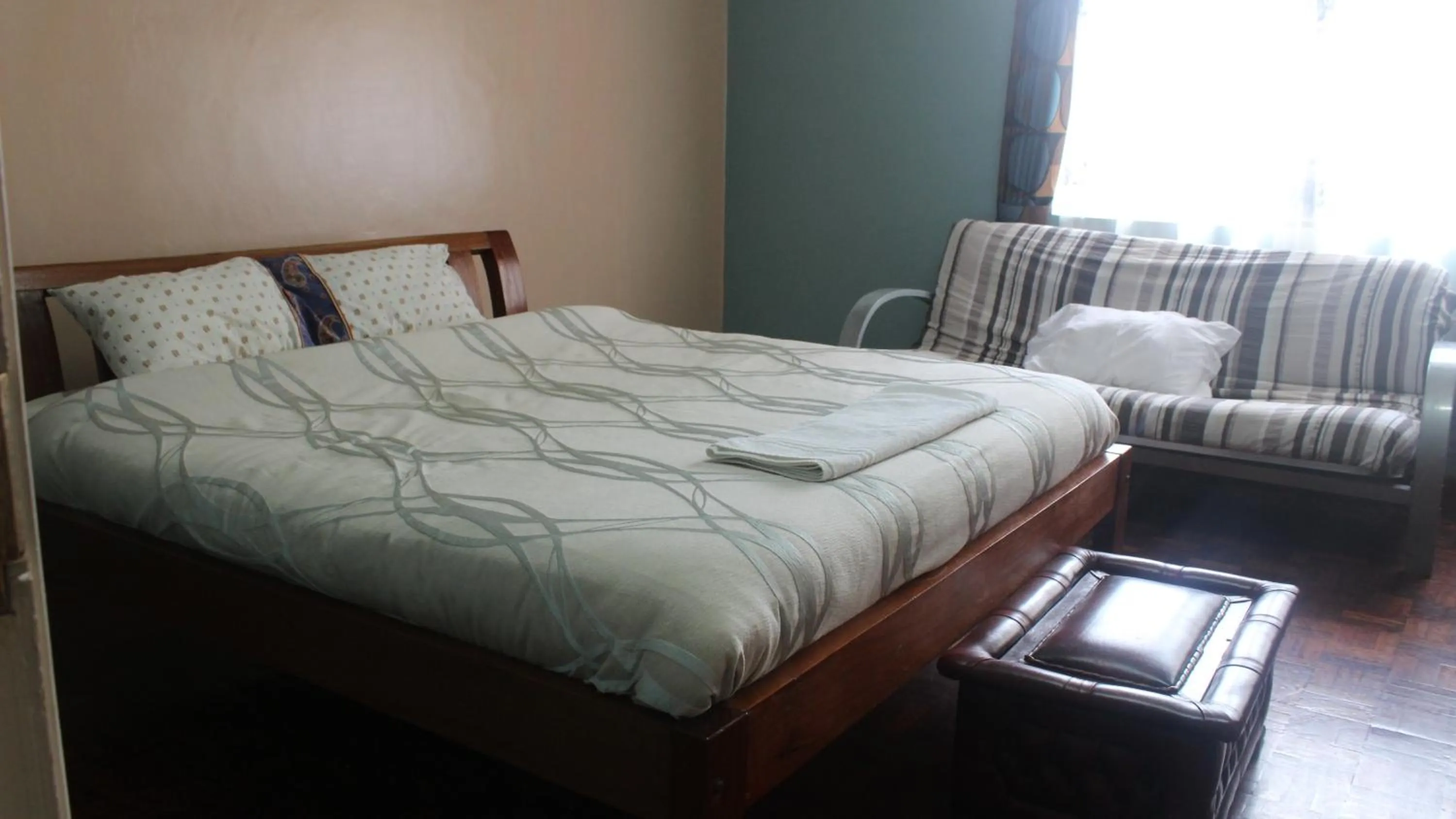 Bed in Tranquil Homestays