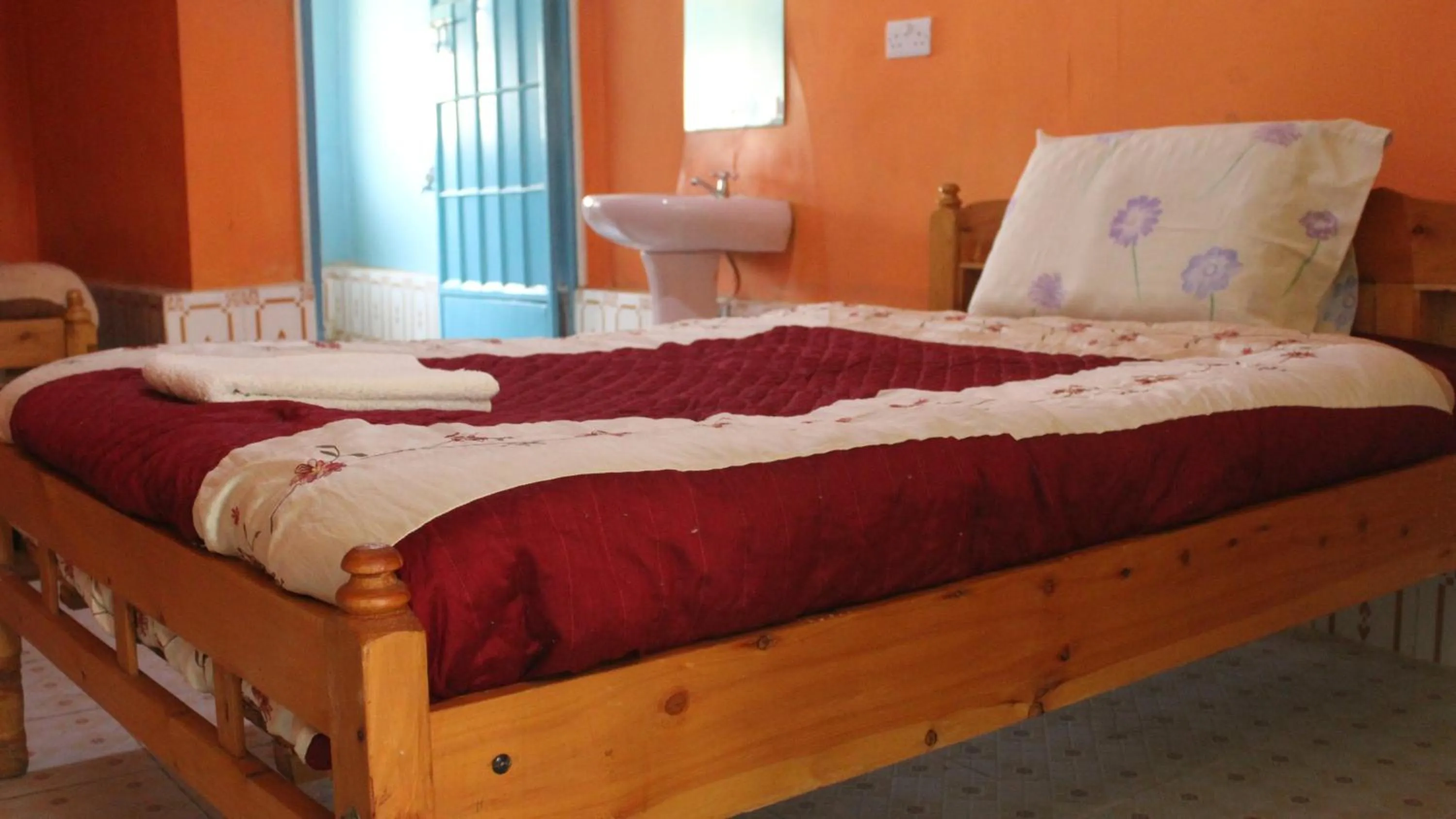 Bed in Tranquil Homestays