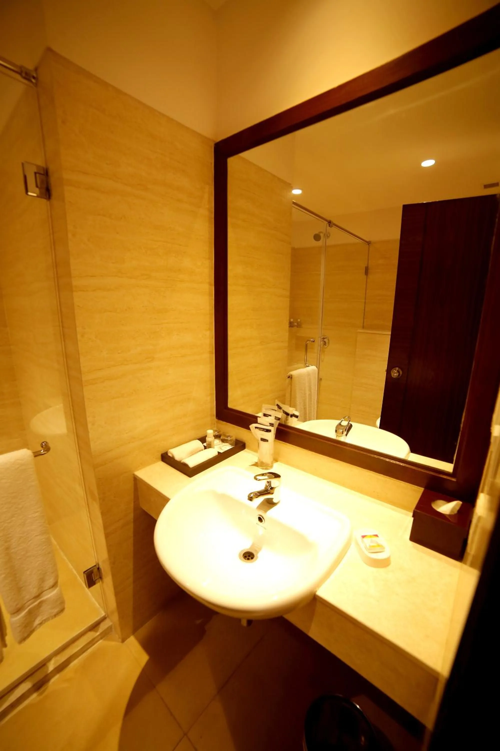 Bathroom in The Lalit Traveller- Airport hotel