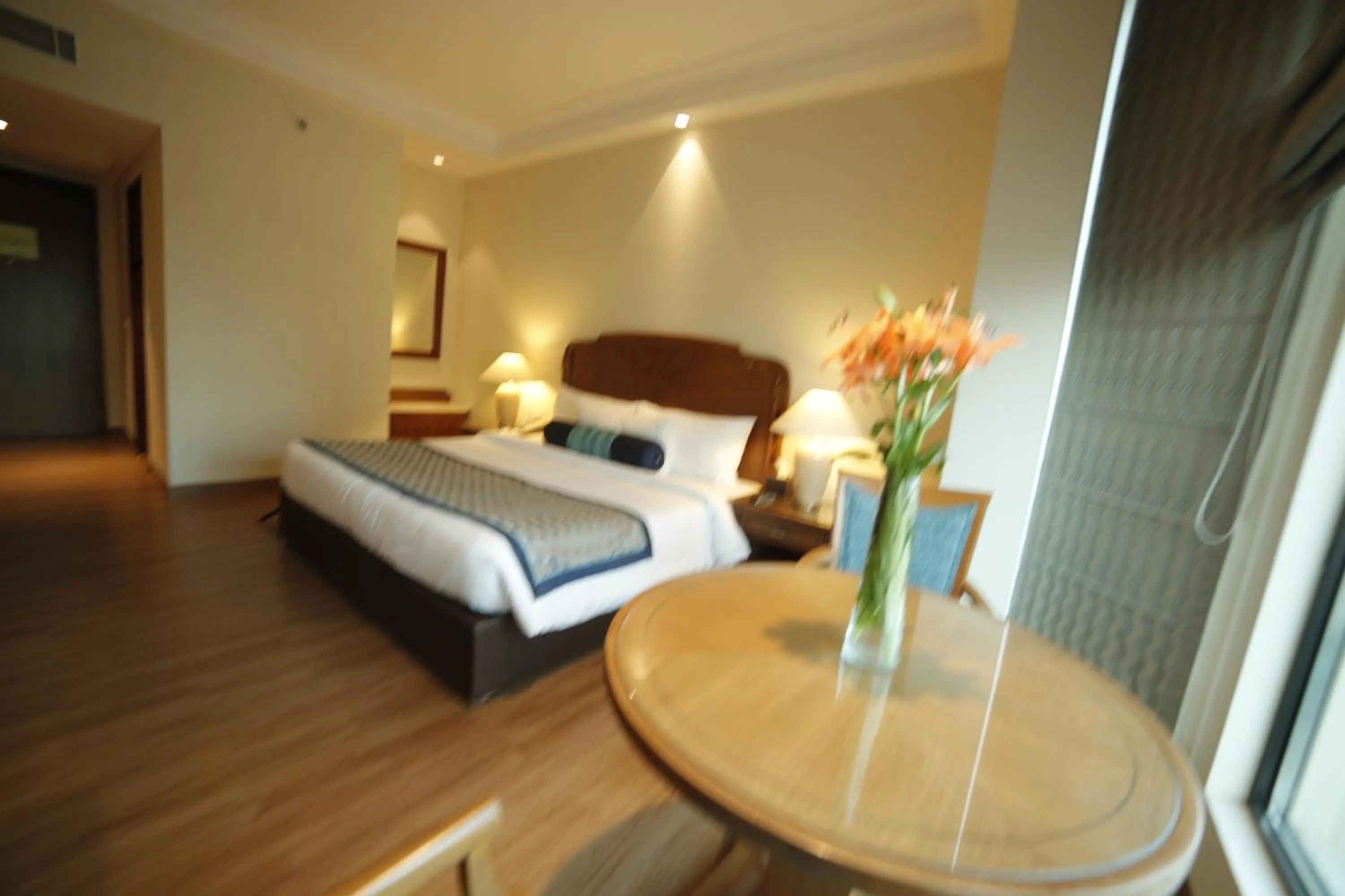 Photo of the whole room, Bed in The Lalit Traveller- Airport hotel