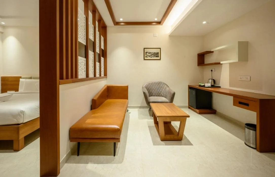 Seating area, Bed in Chithara Comforts