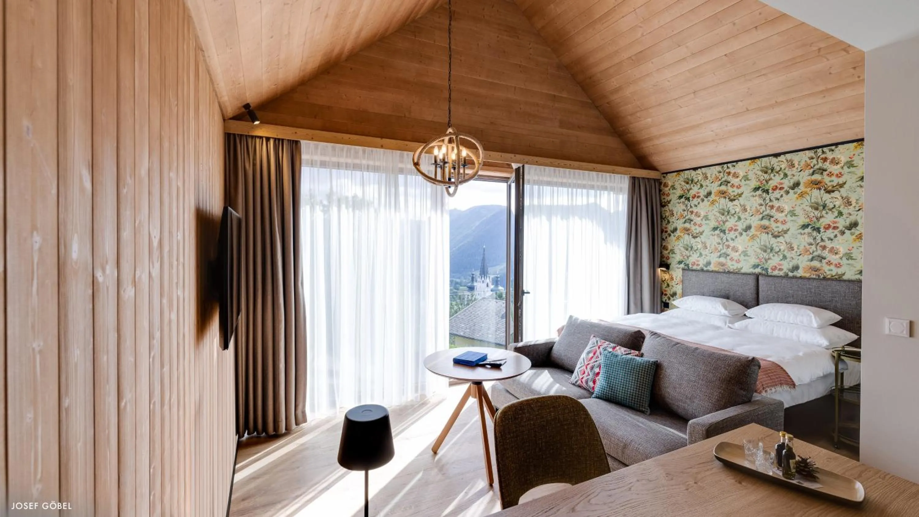 Living room, Bed in Hideaway Hotel Montestyria Chalets & Suiten