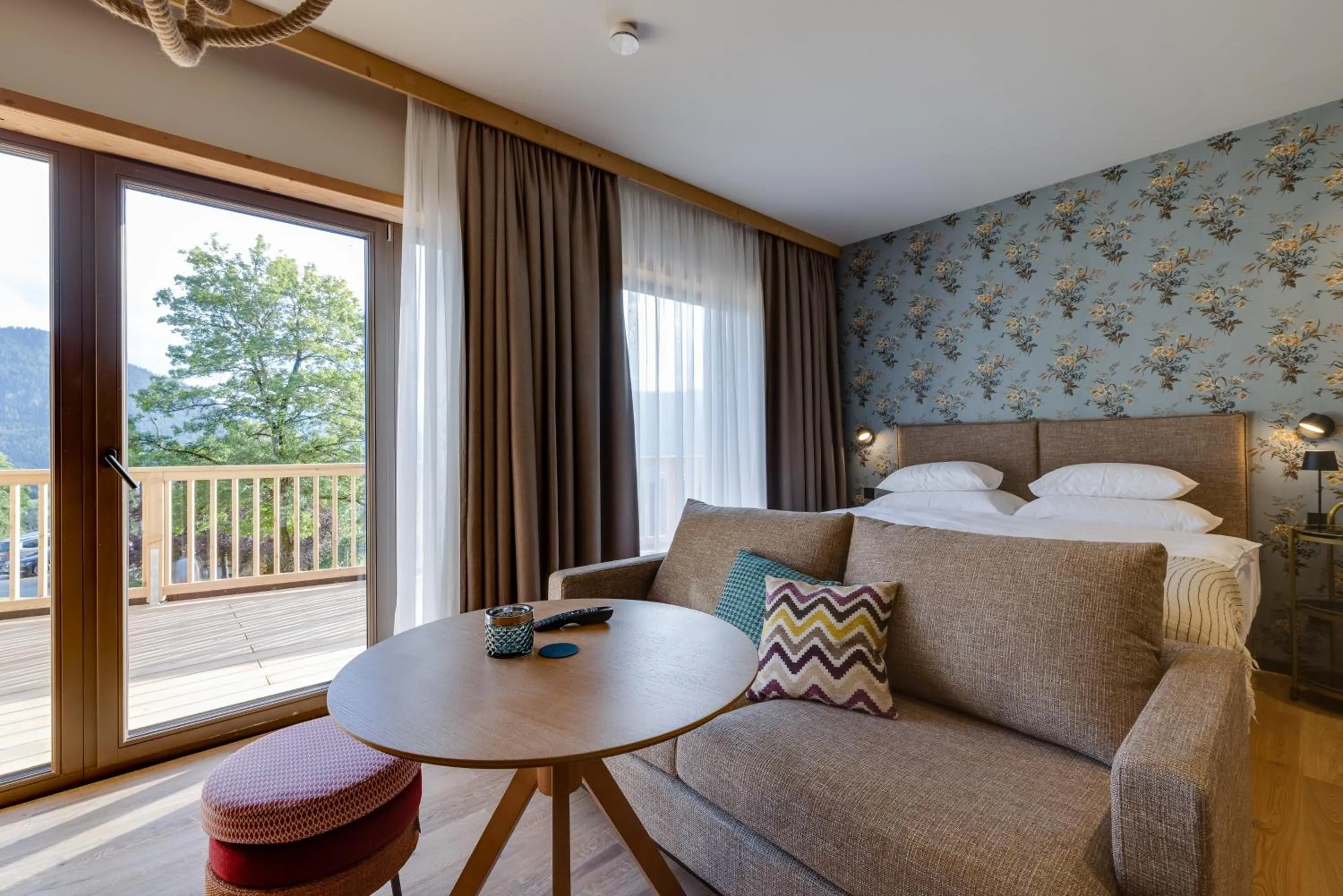 Living room, Bed in Hideaway Hotel Montestyria Chalets & Suiten