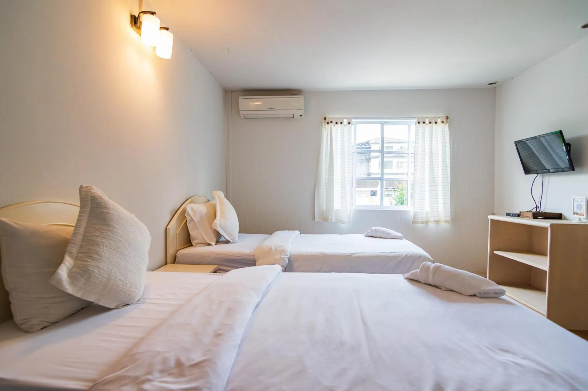 Bed in THANSILA Resort