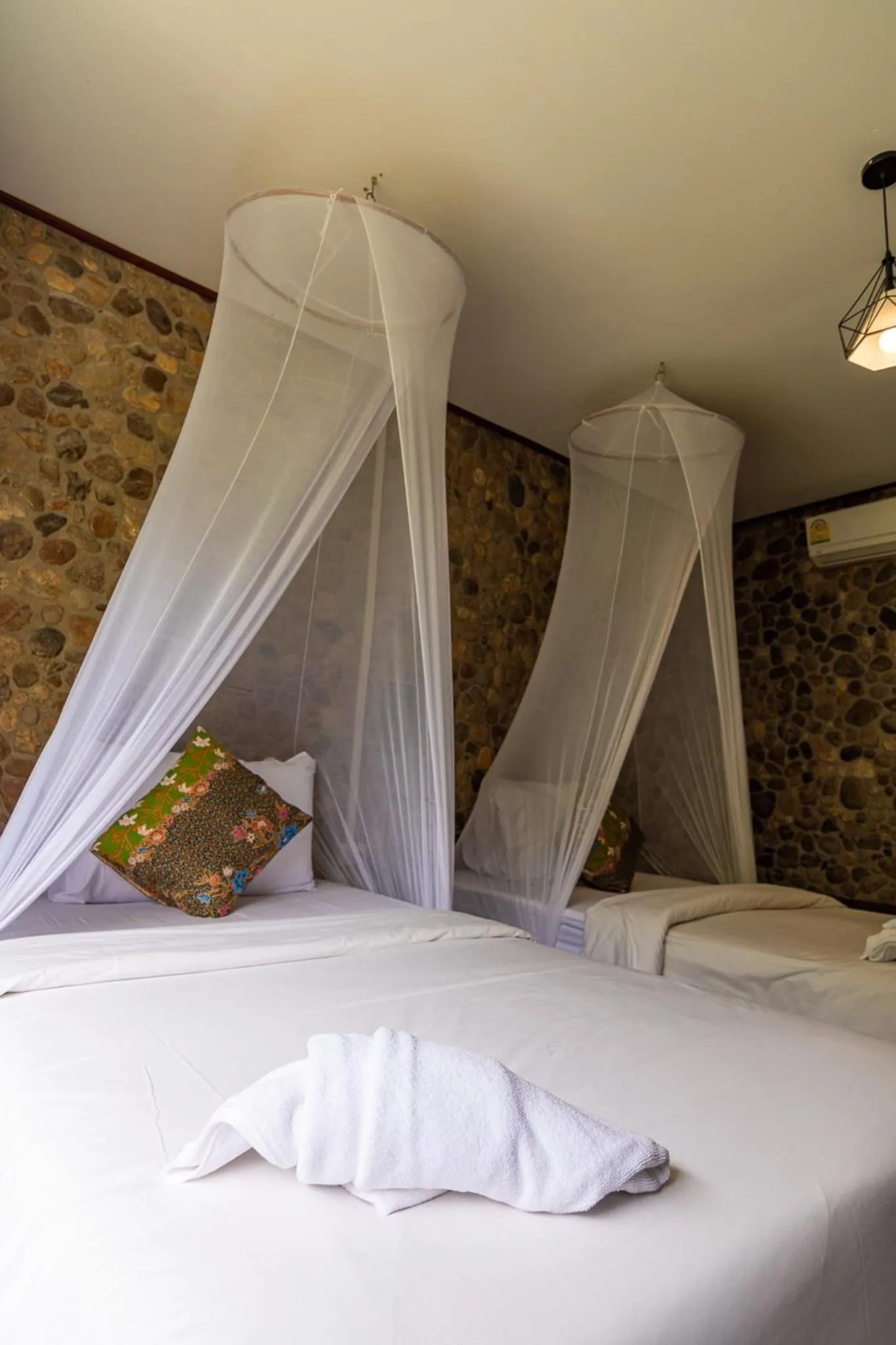 Bed in THANSILA Resort