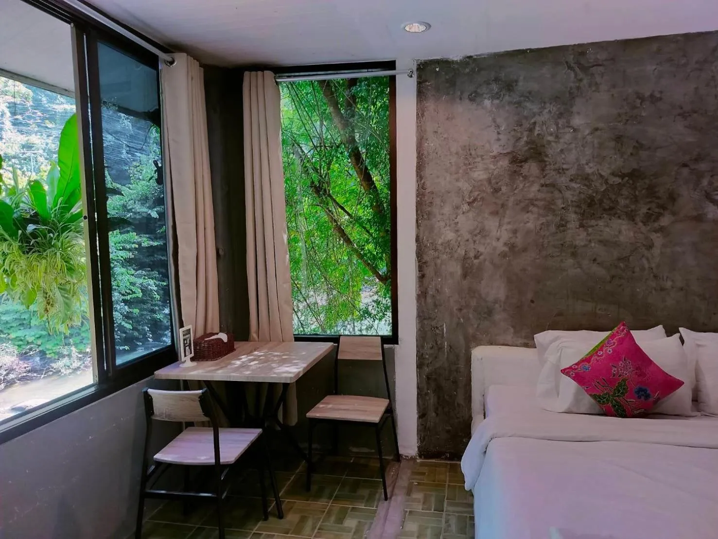 Seating area, Bed in THANSILA Resort