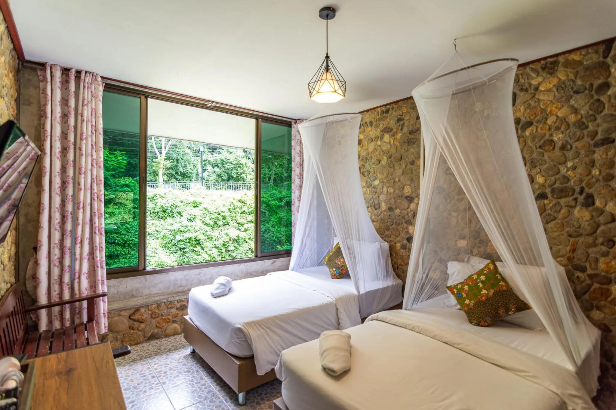 Bed in THANSILA Resort