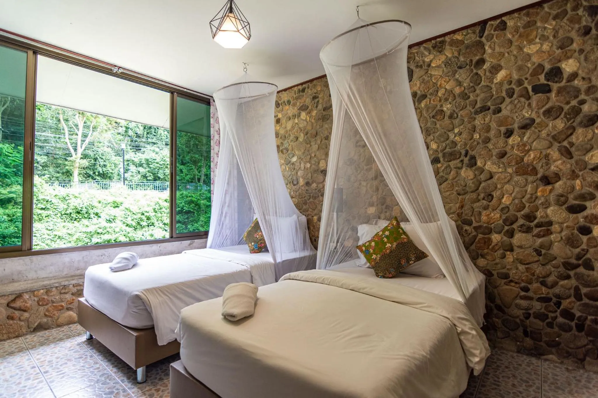 Bed in THANSILA Resort