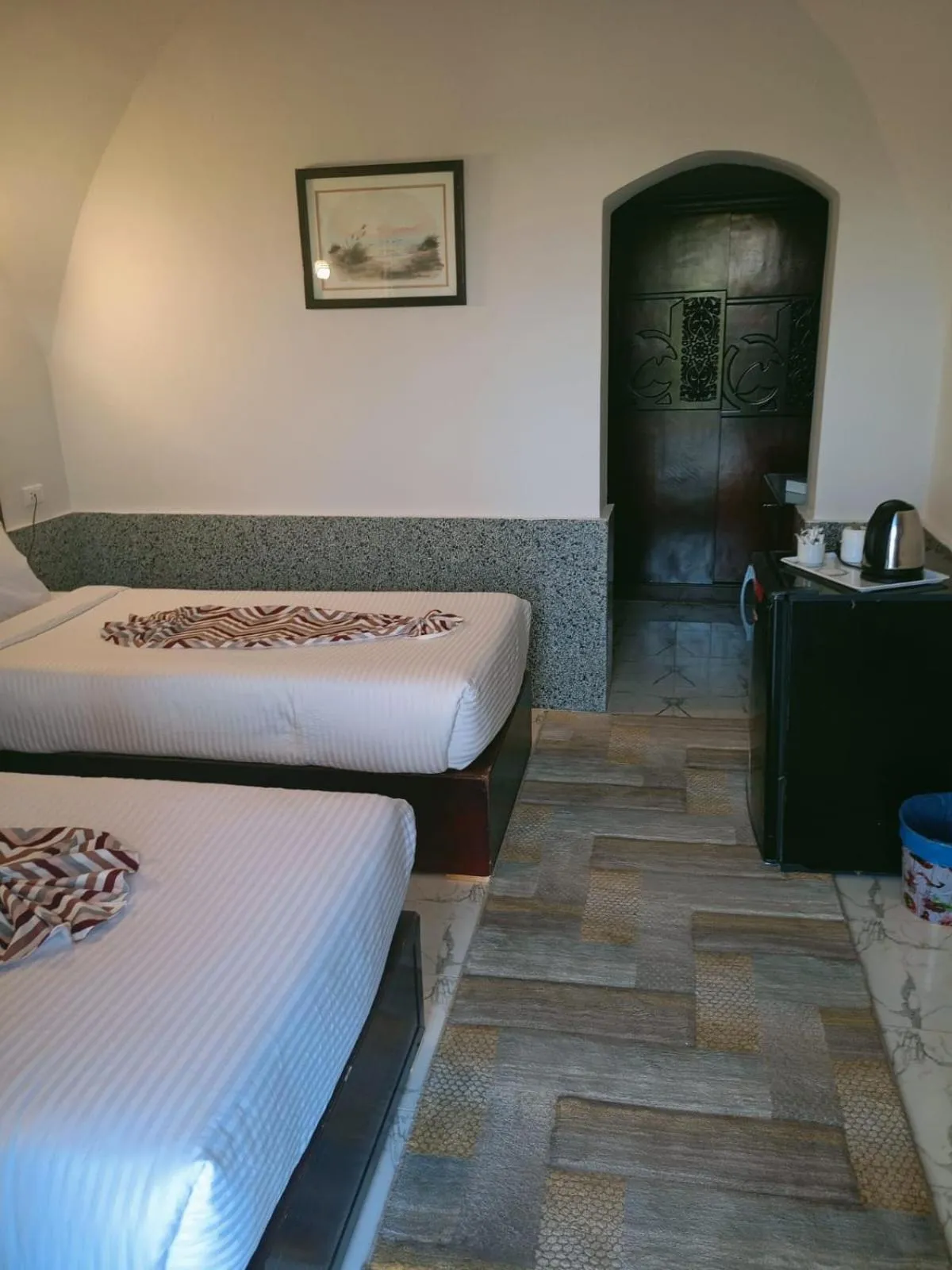 Bed in Dolphin Continental Hotel