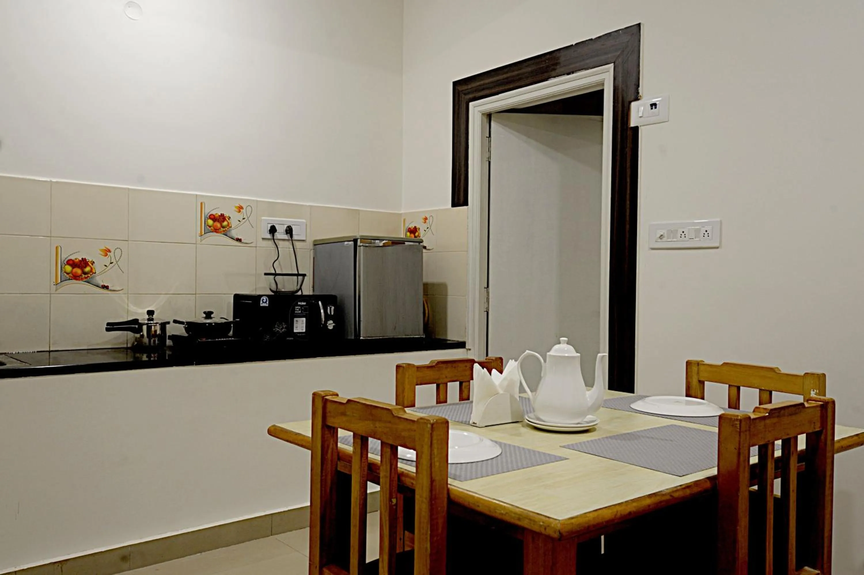 Kitchen or kitchenette in Airport Bliss Boutique Hotel Near Kempegowda International Airport Bangalore