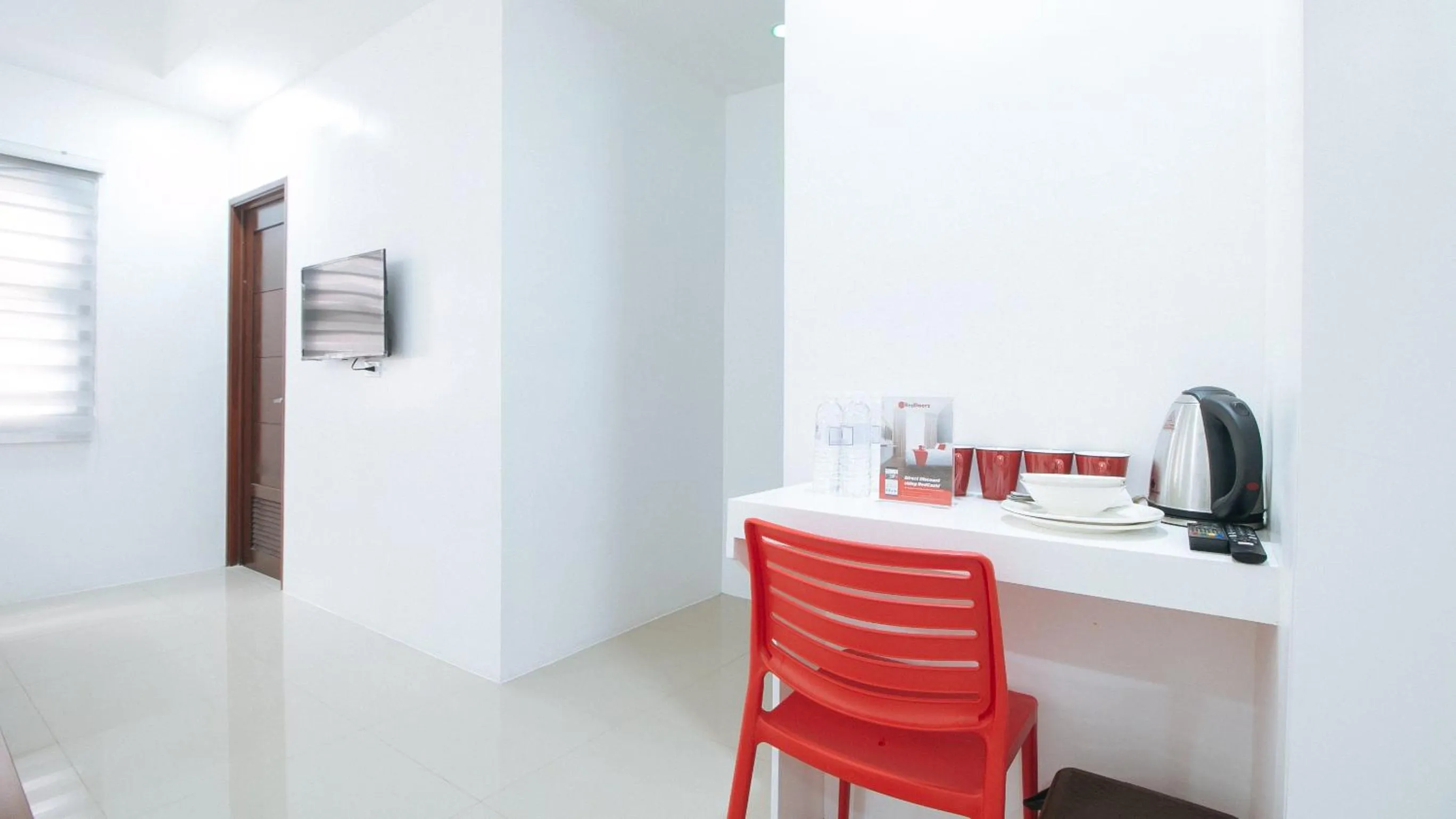 Seating area in RedDoorz Plus at DBuilders Poblacion BGC