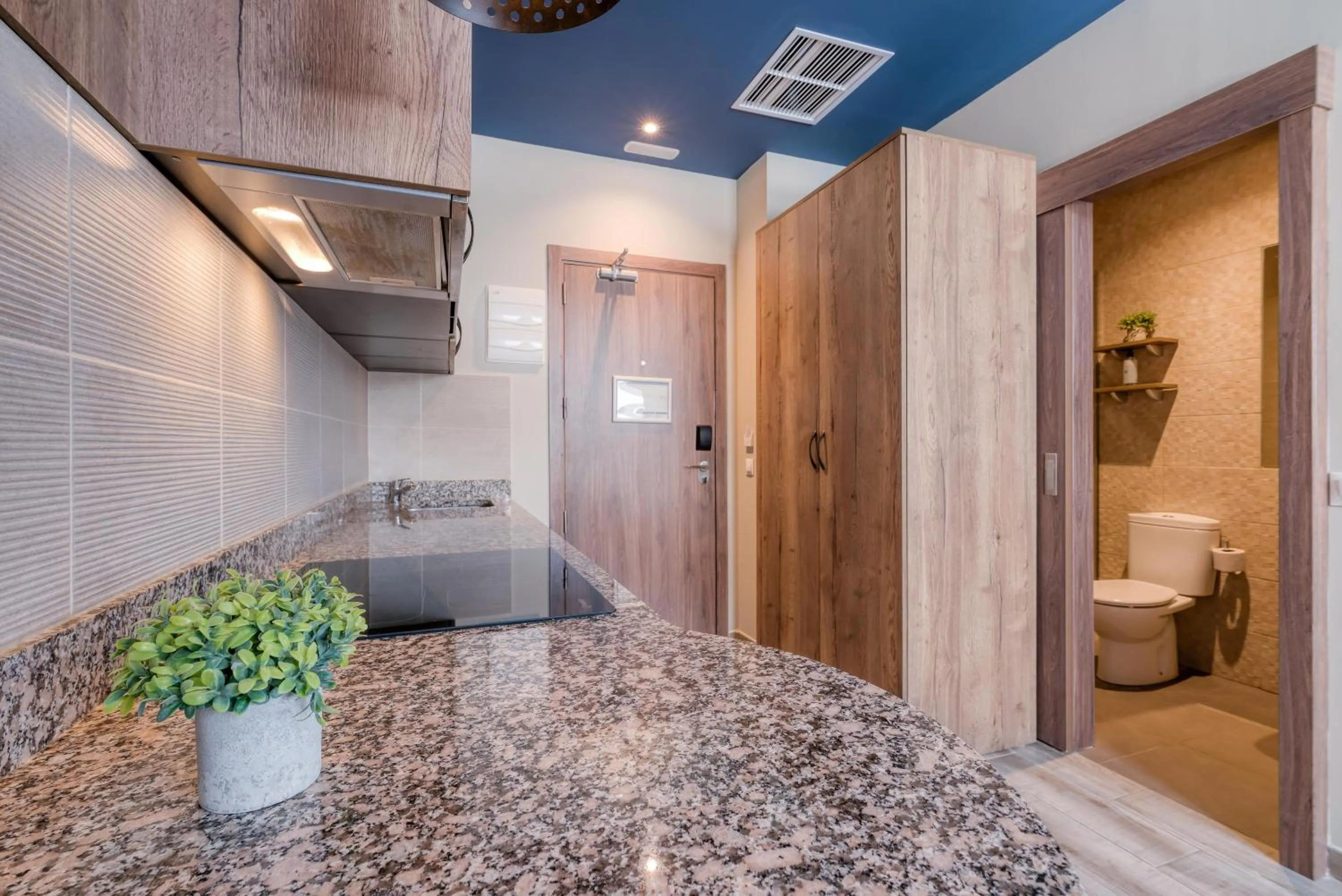 stove in Livensa Living Studios Valencia Marina Real Hotel-Apartamento