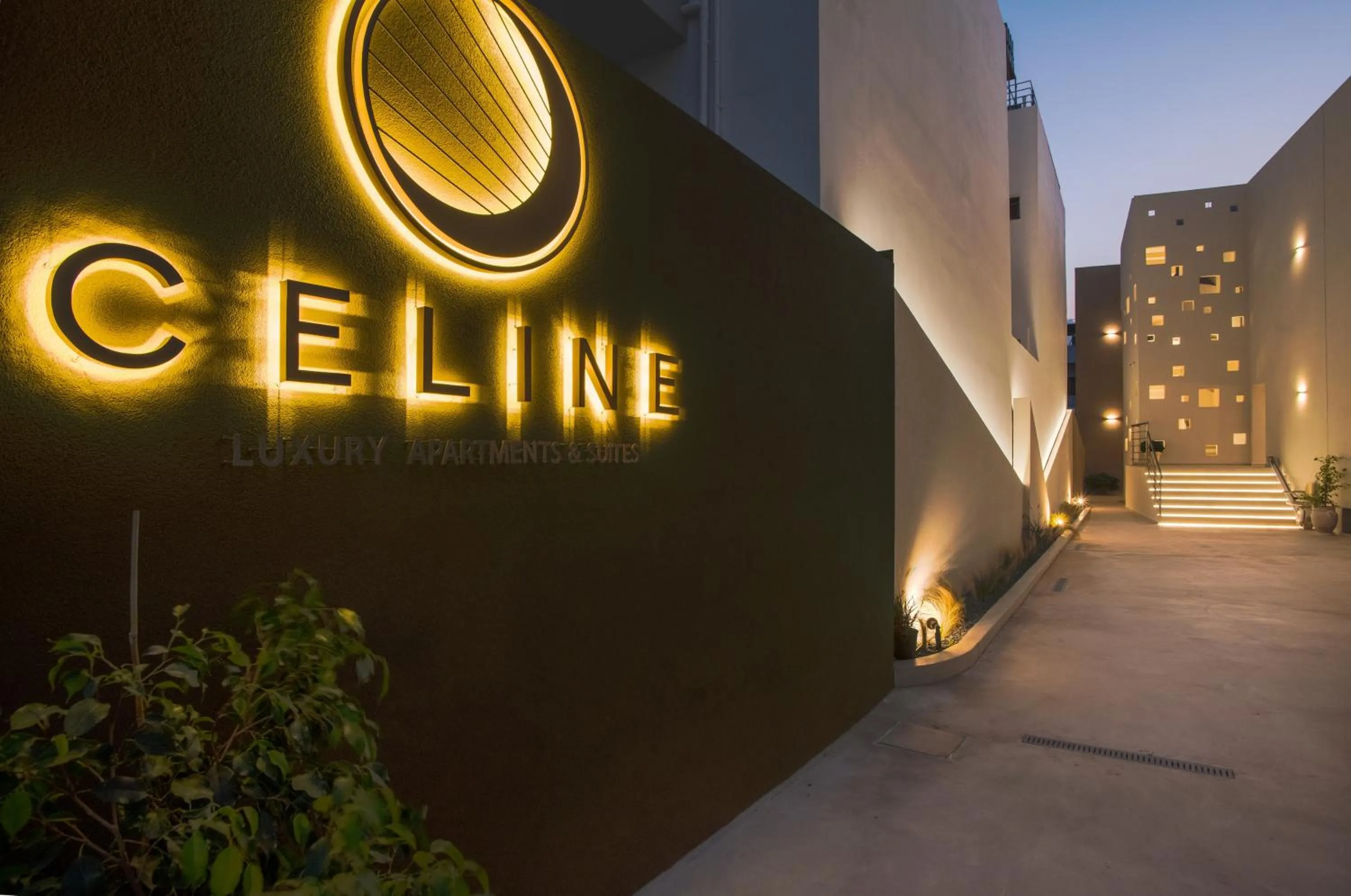 Property logo or sign in Celine Luxury Apartments & Suites