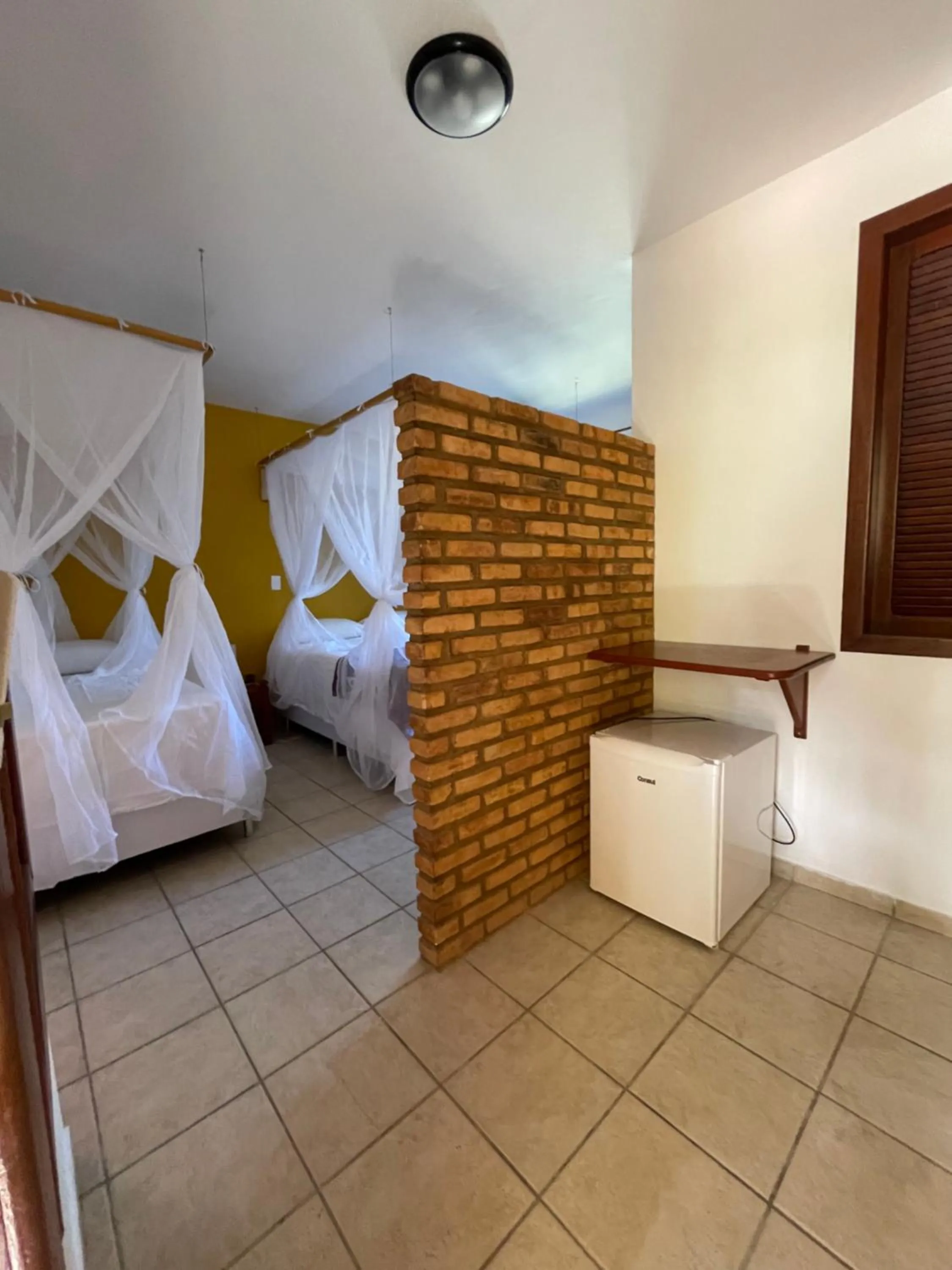 Bed in Pousada Arraial Colonial, Localizada no Centrinho e de Fácil Acesso a Praia e a Rua Mucugê