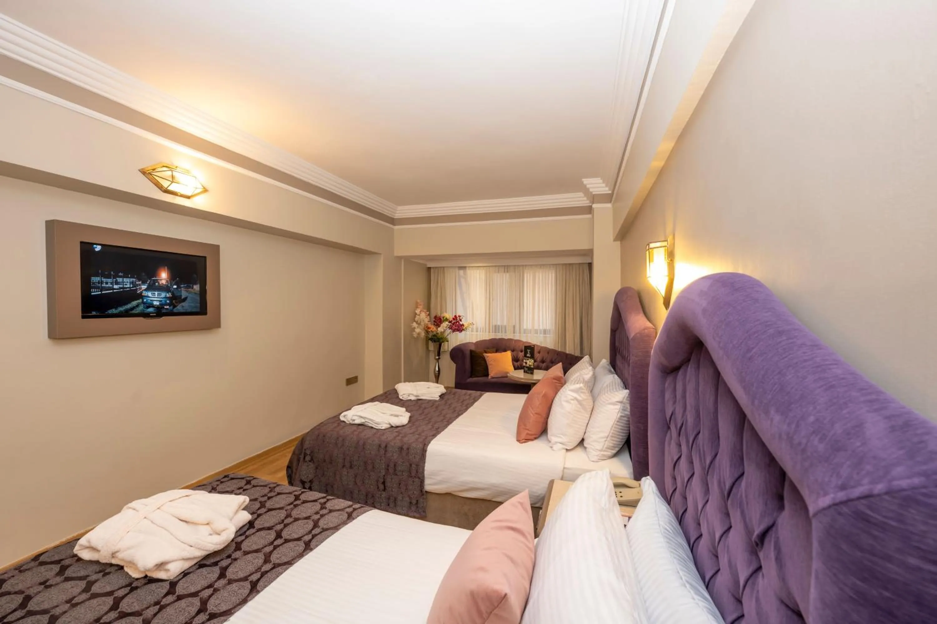 Bed in Grand Anka Hotel