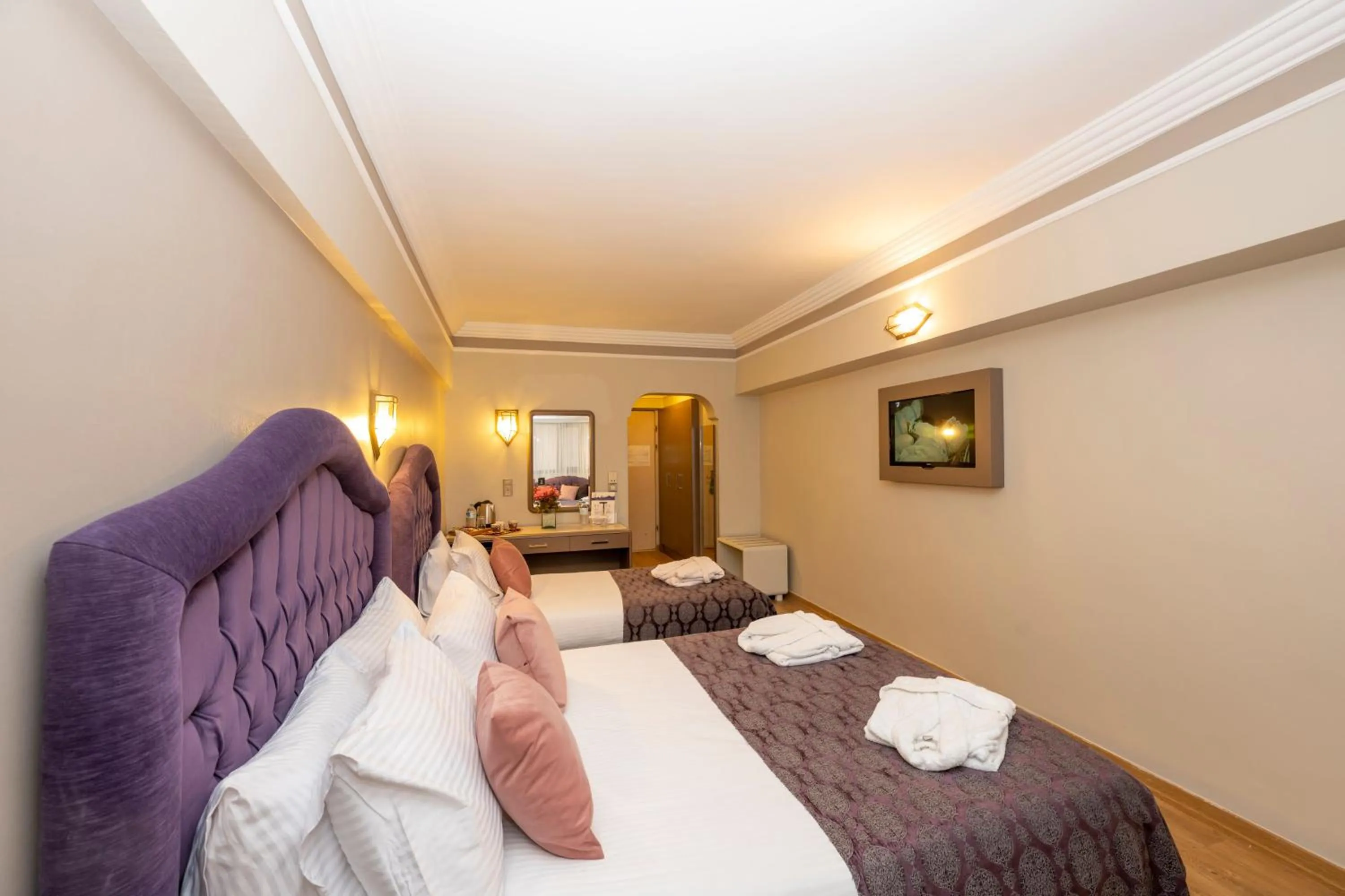 Bed in Grand Anka Hotel