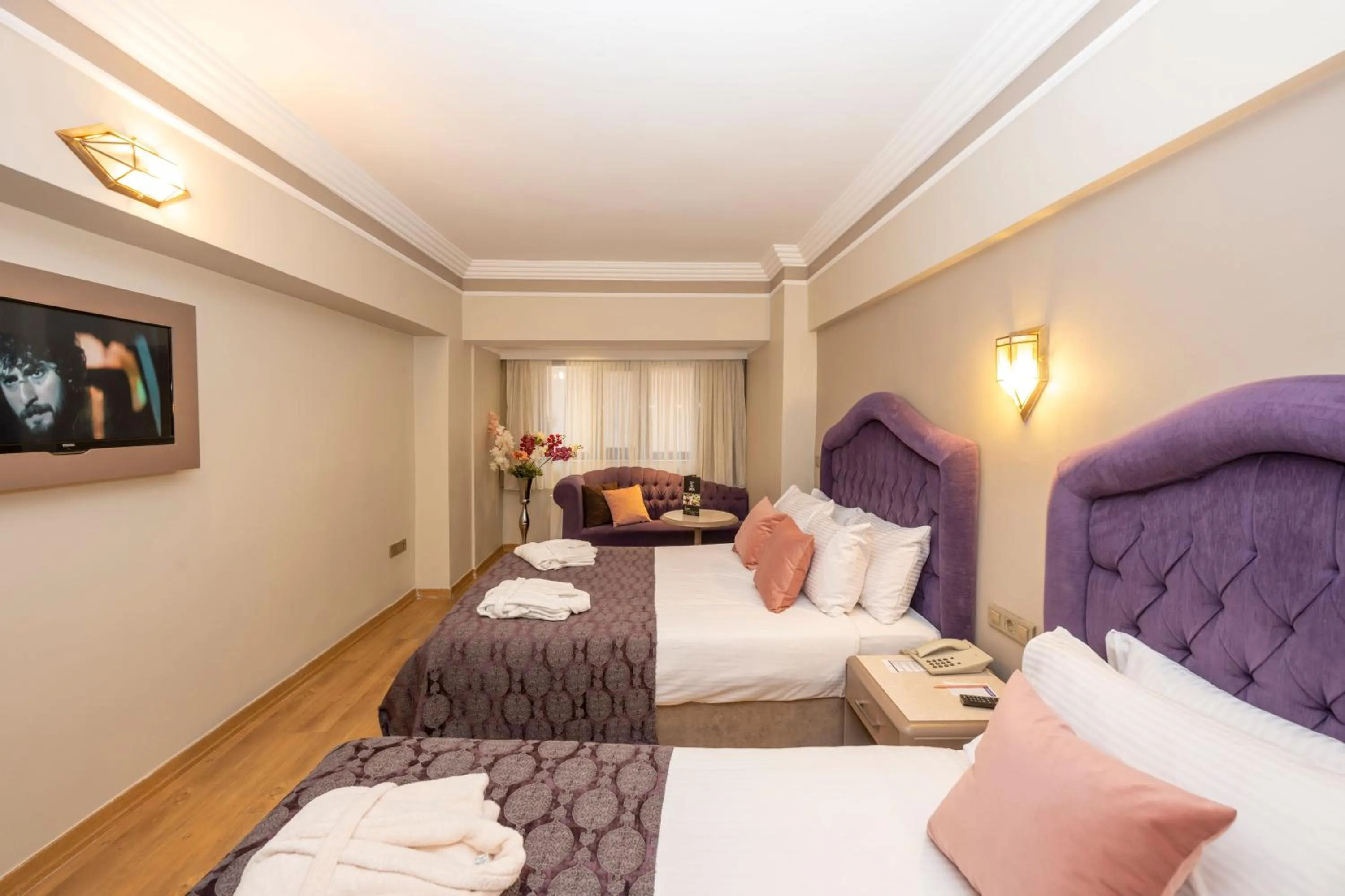 Bed in Grand Anka Hotel