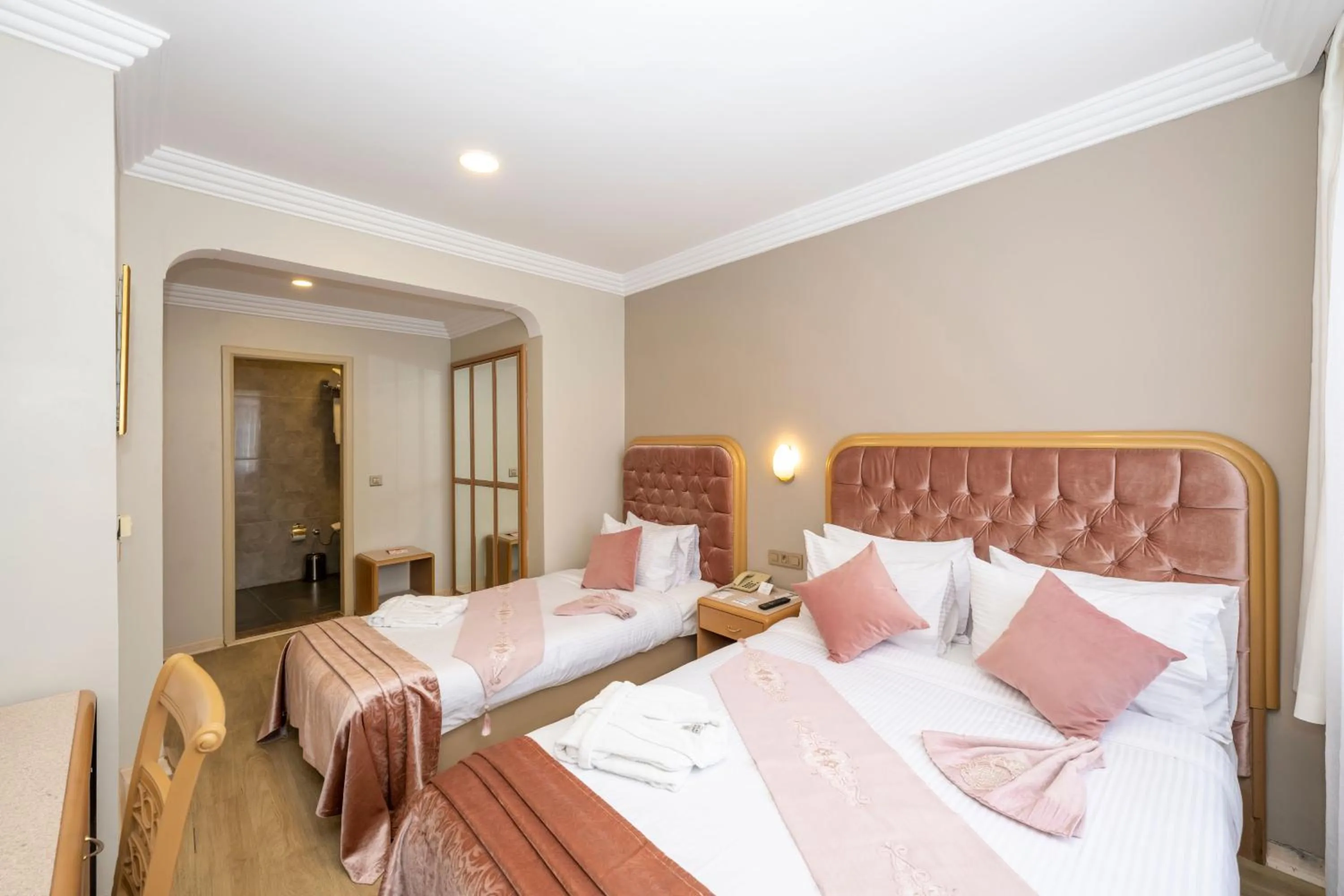 Bed in Grand Anka Hotel