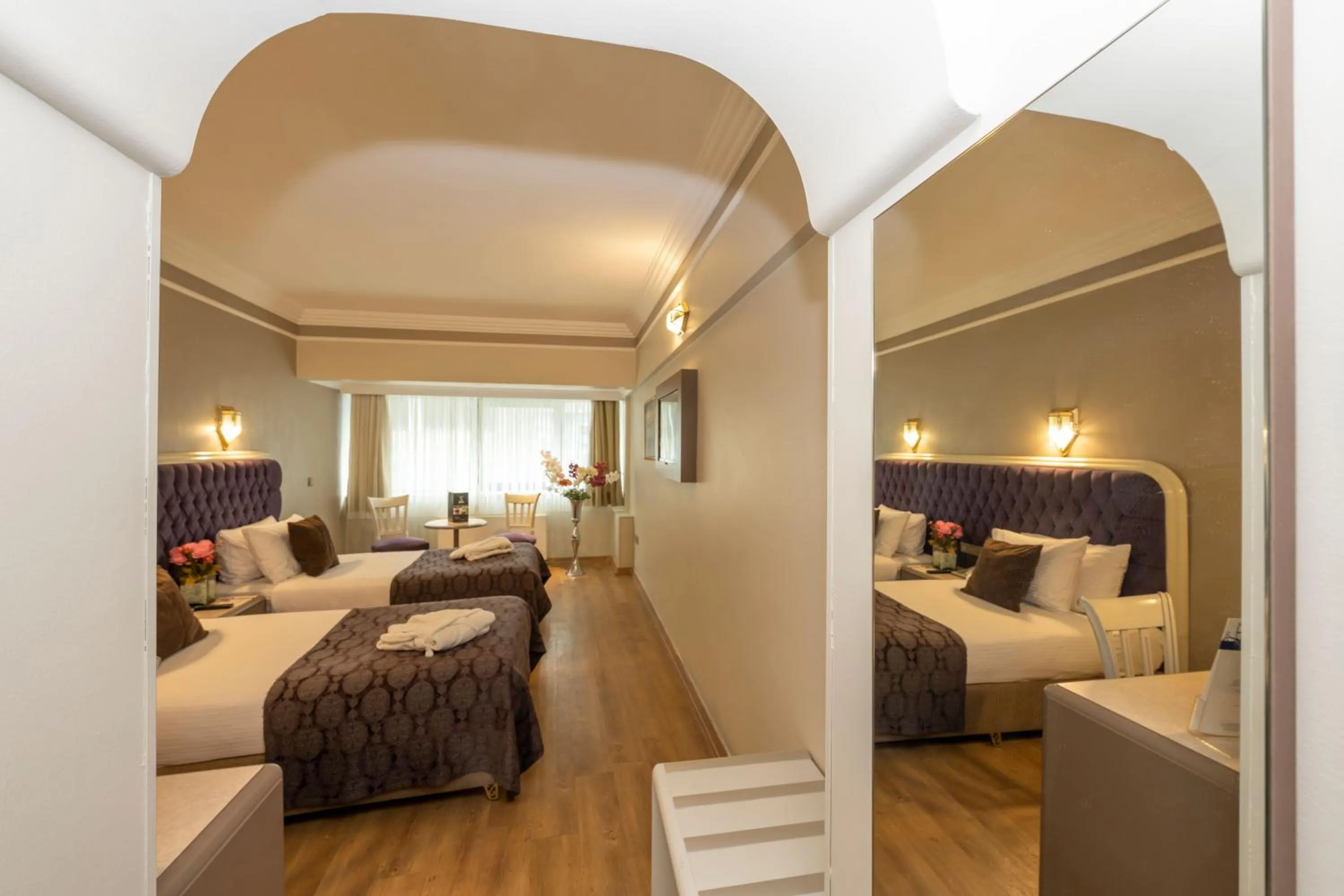 Bed in Grand Anka Hotel