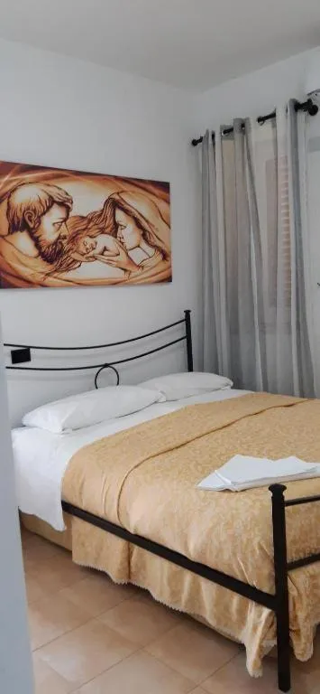 Photo of the whole room, Bed in Oasi Madre della Pace